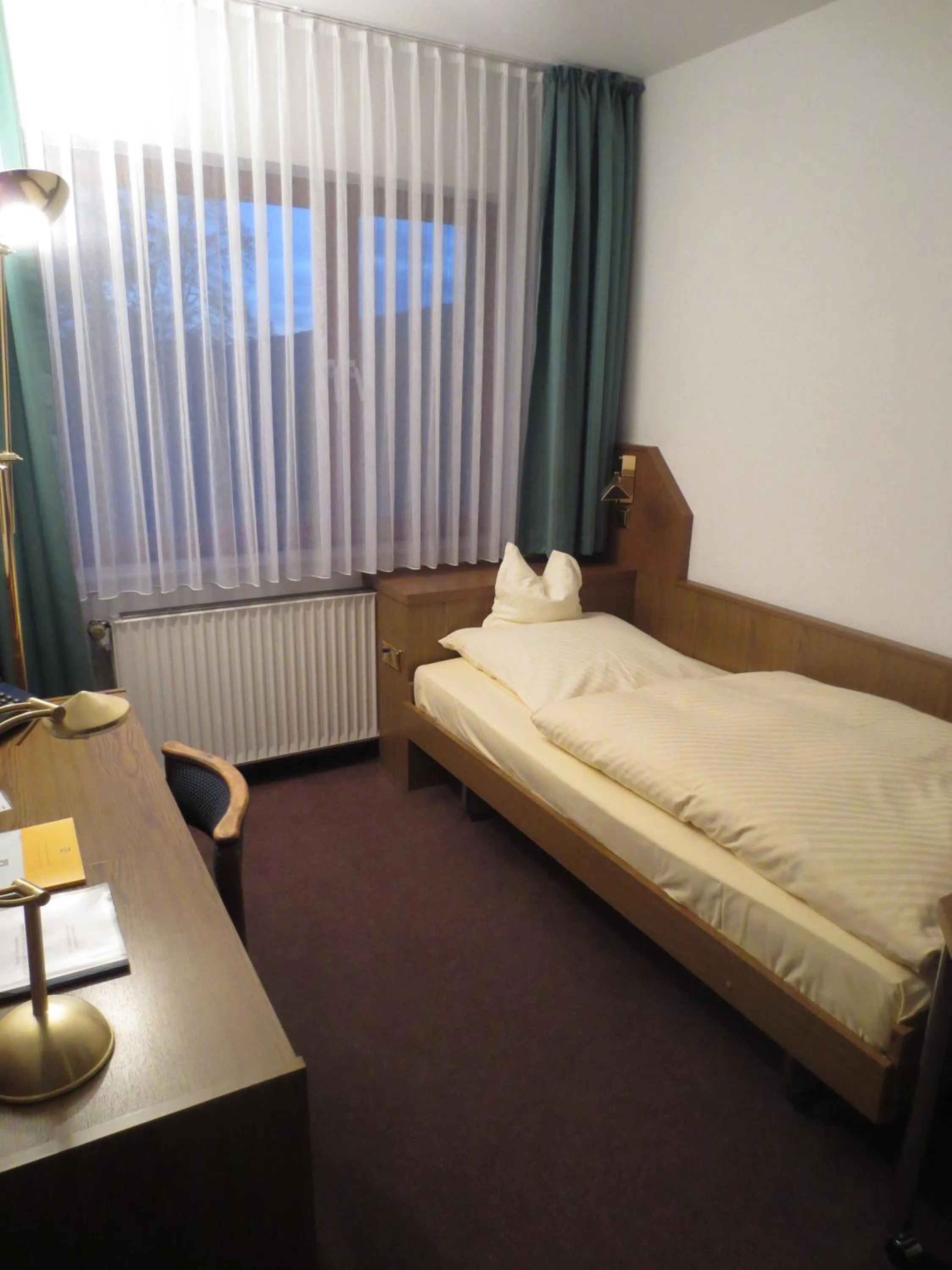 Photo of the whole room, Bed in Parkhotel Goldlinde