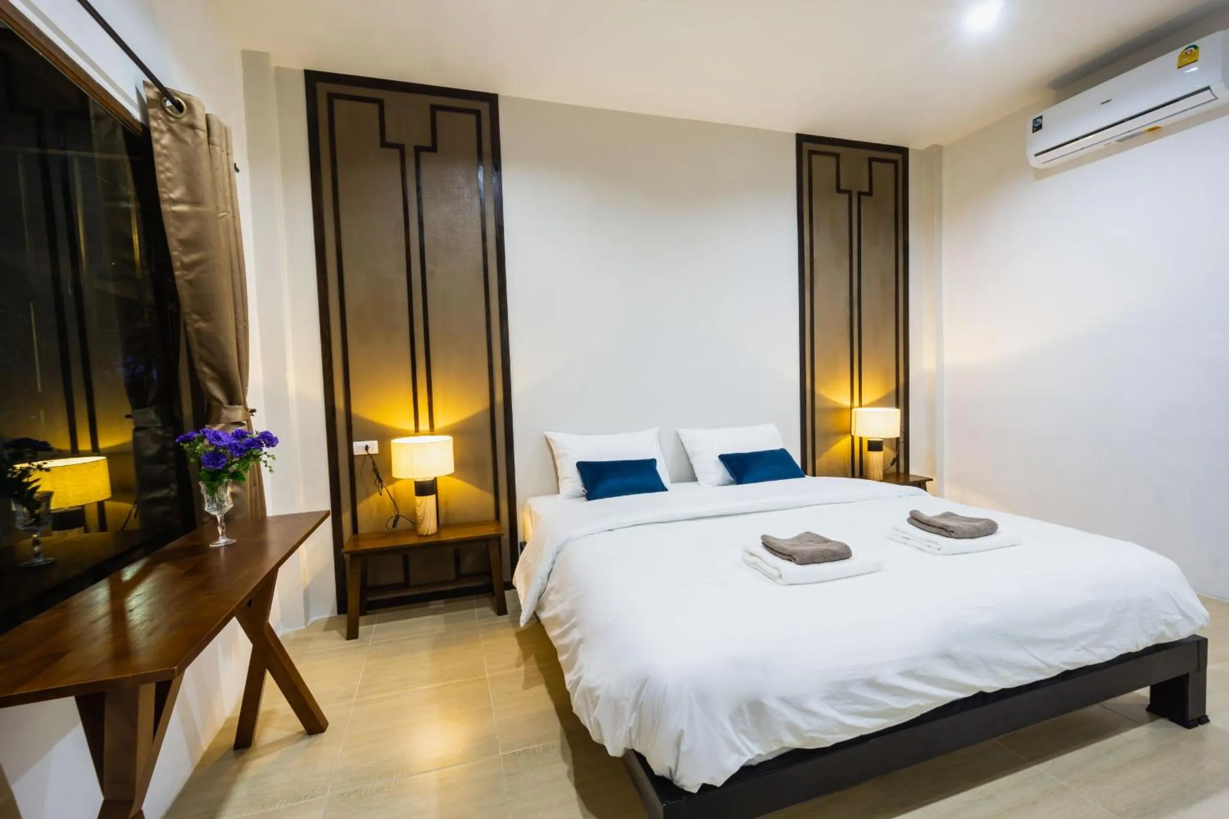 Bed in Nararin Garden House