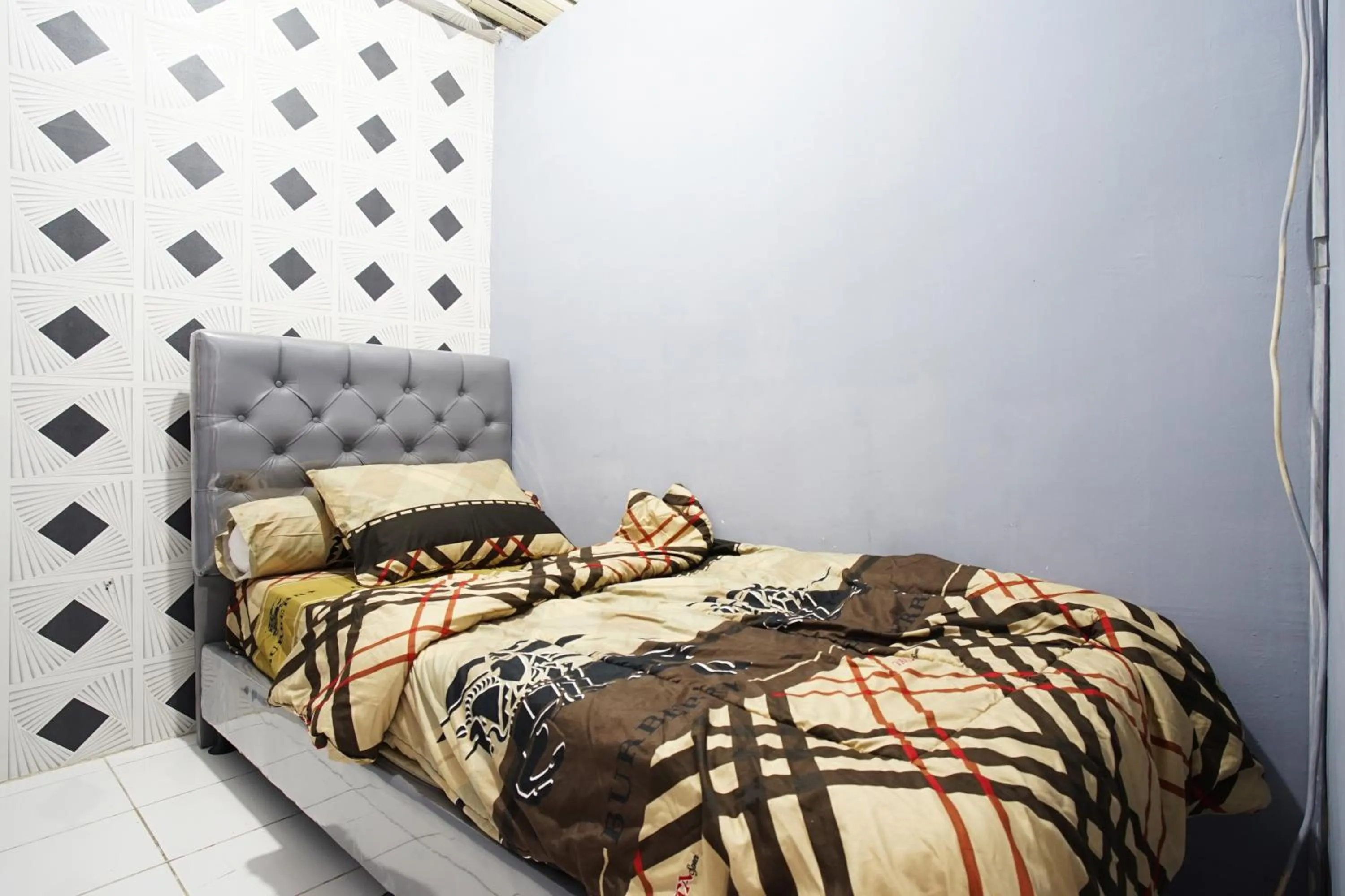 Bed in City Park Apartment by Anita