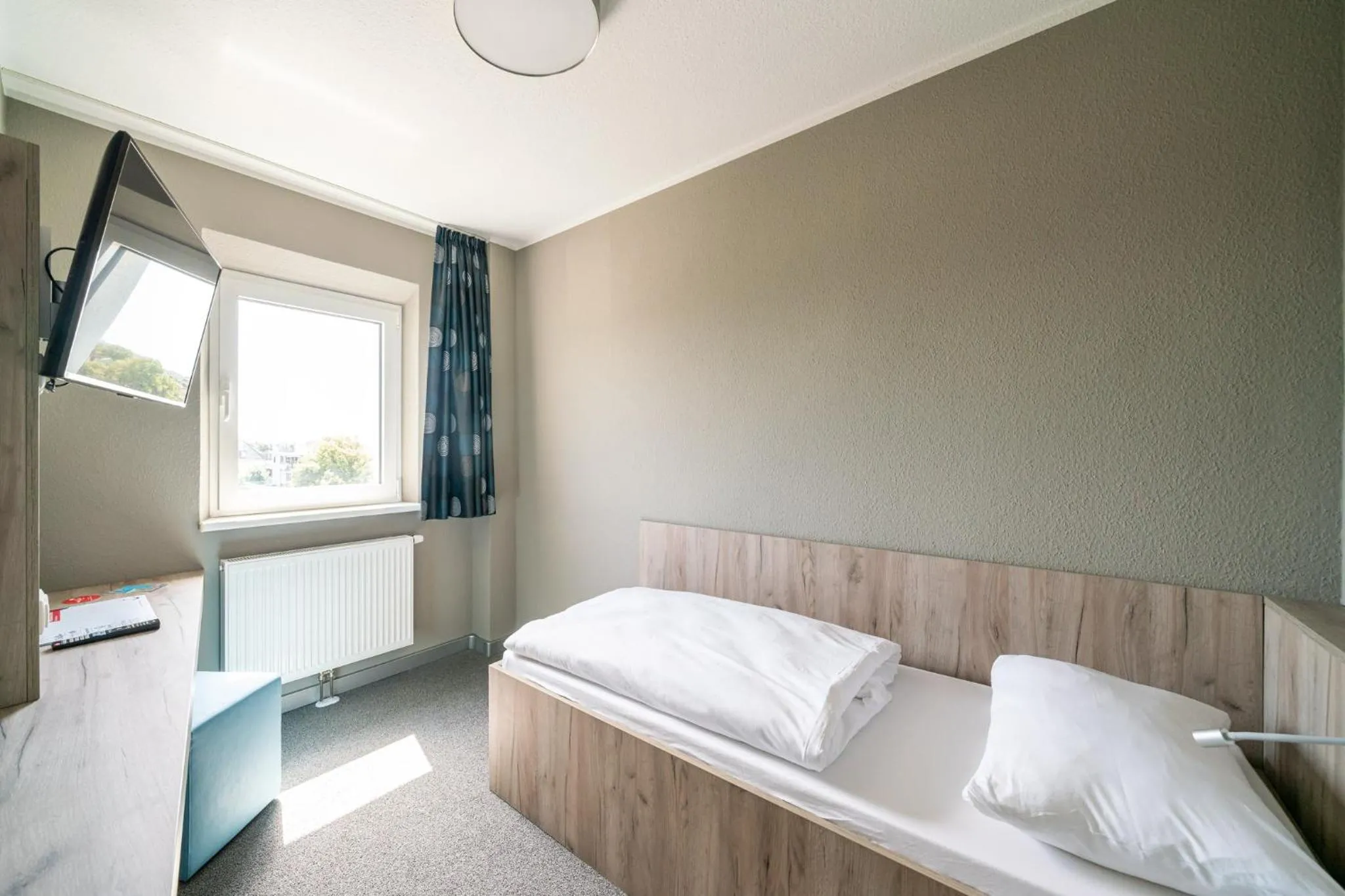 Photo of the whole room, Bed in WIROtel Warnemünde