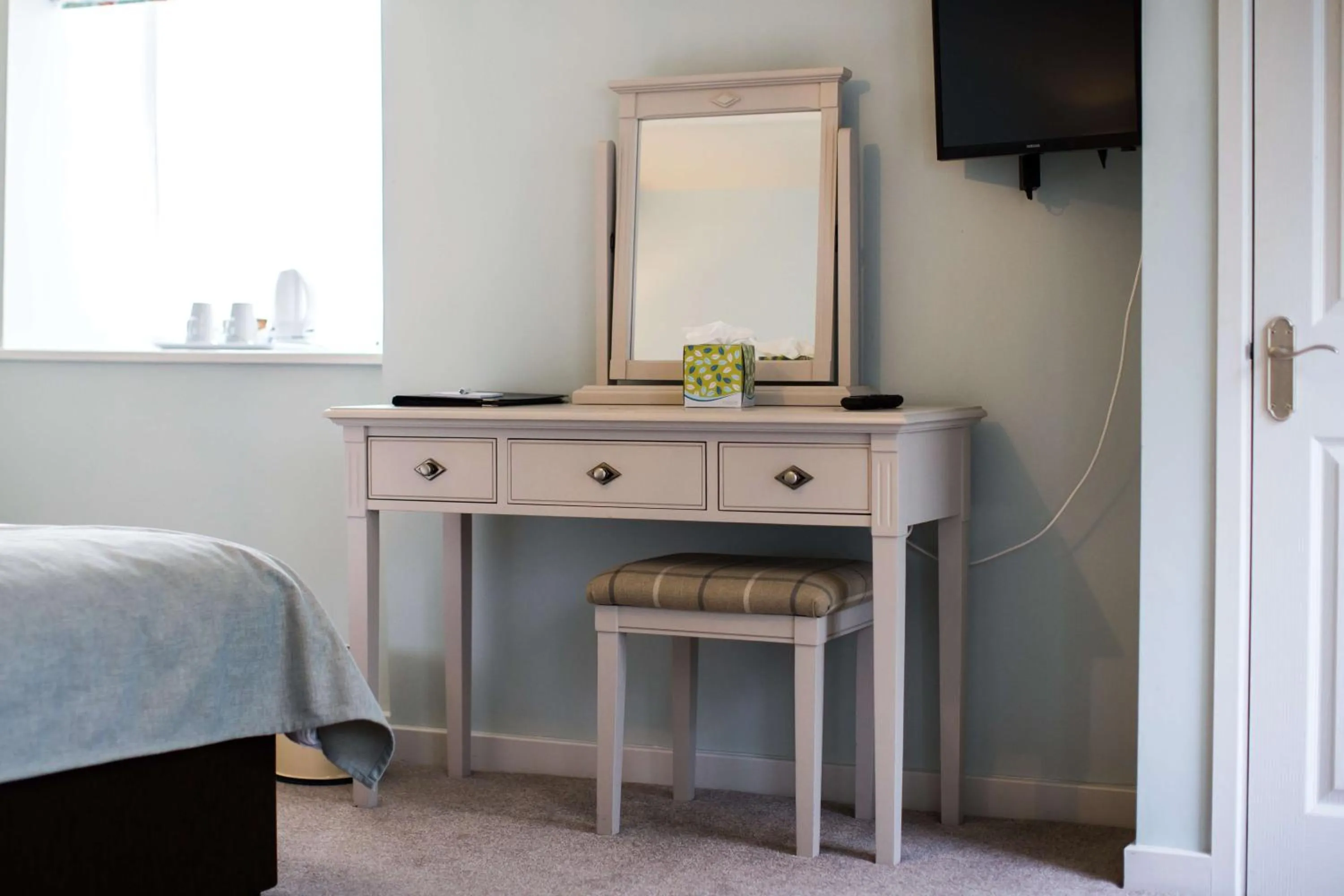 Bed in The Wyndham Hotel