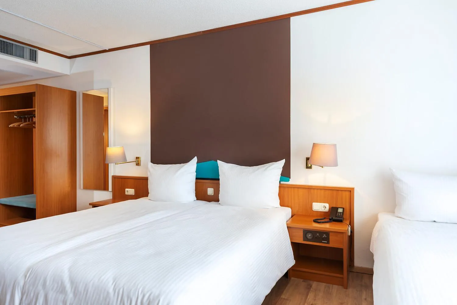 Bed in ACHAT Hotel Frankfurt Maintal