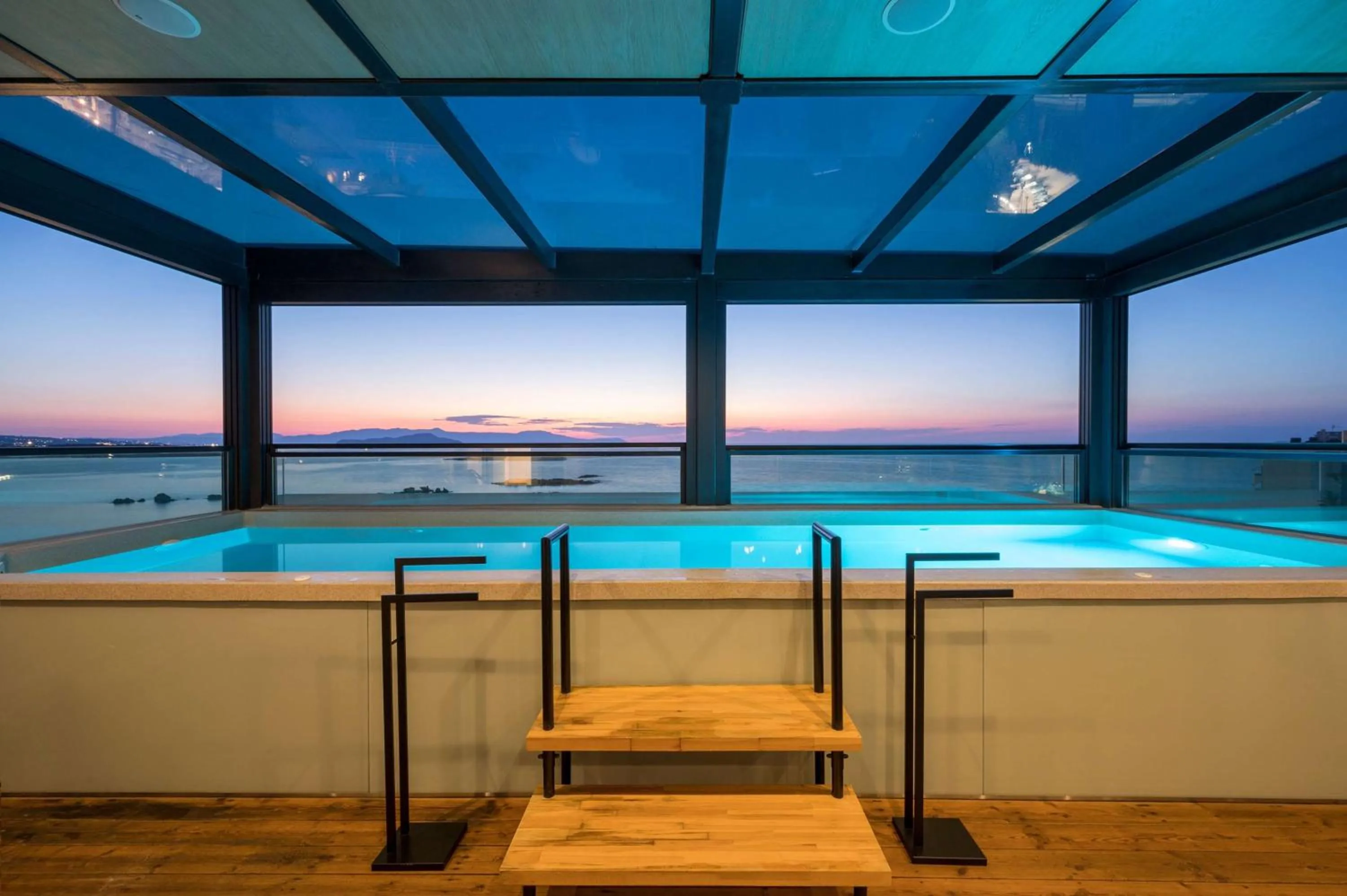 Pool view in Chania Flair Boutique Hotel, Adults only, Tapestry Collection by Hilton