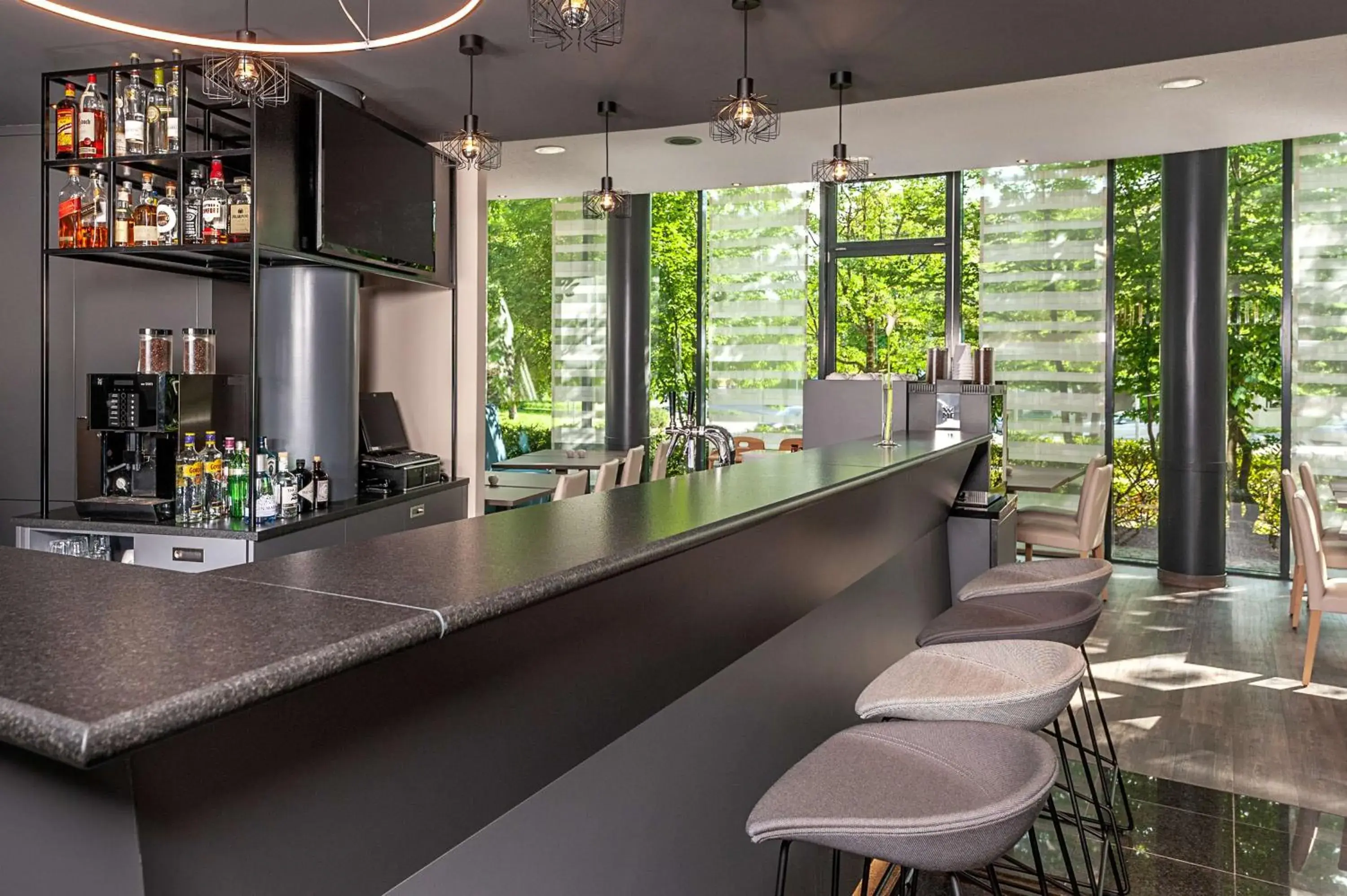 Lounge or bar in NH München Unterhaching Lounge or bar in NH München Unterhaching