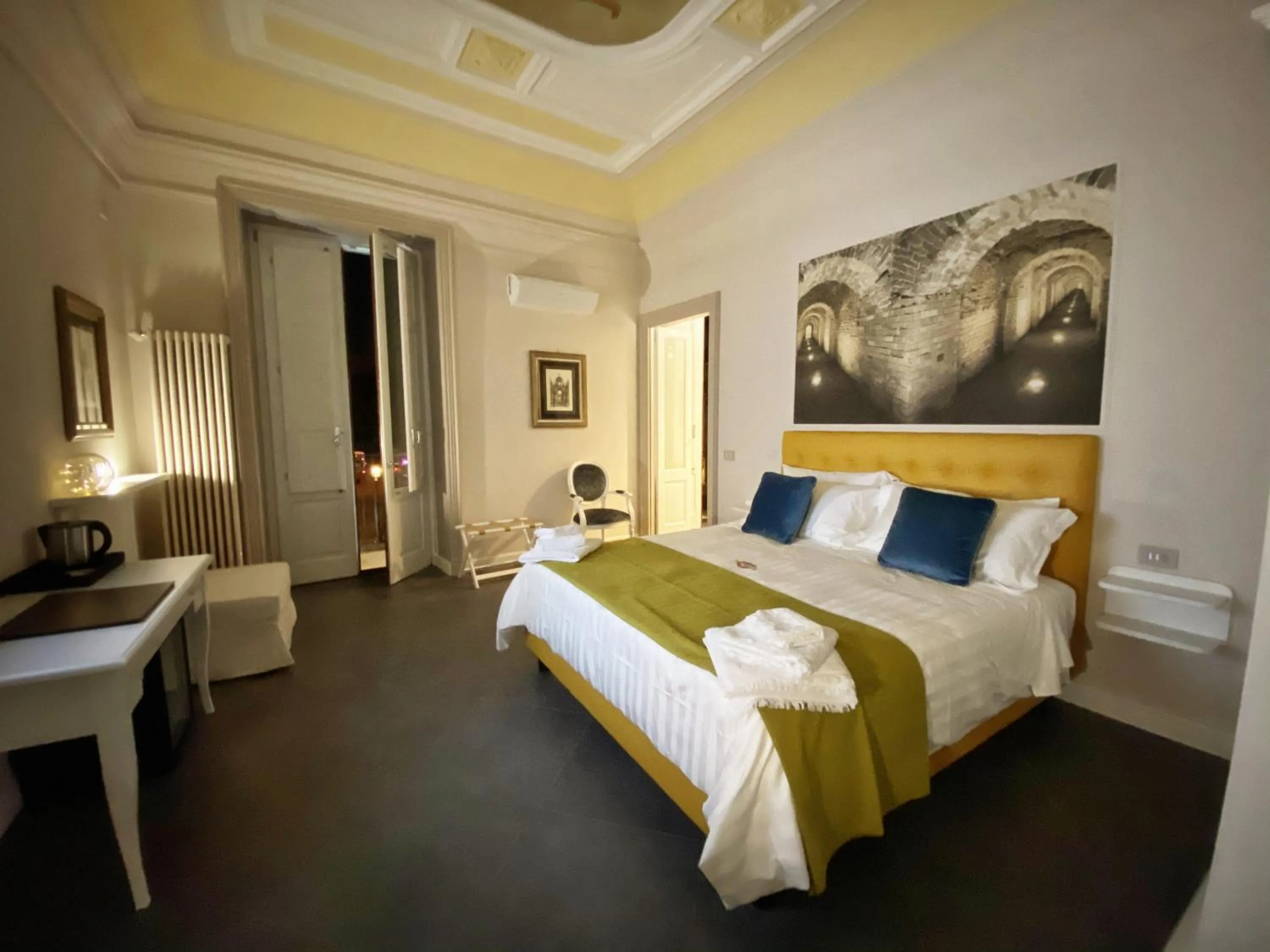 Bed in ANFITEATRO LE SUITES