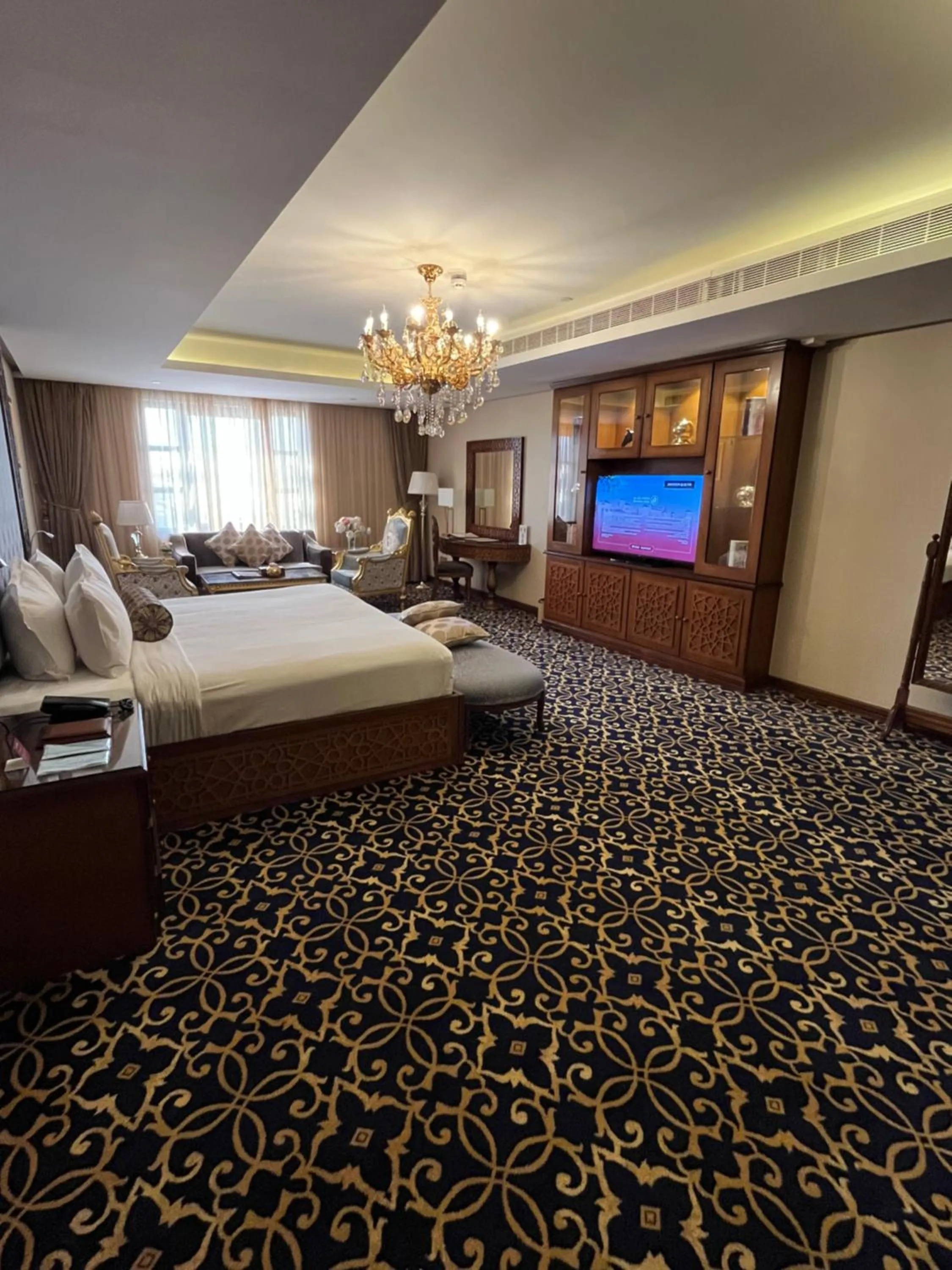 Communal lounge/ TV room, Bed in Al Rahden Hotel