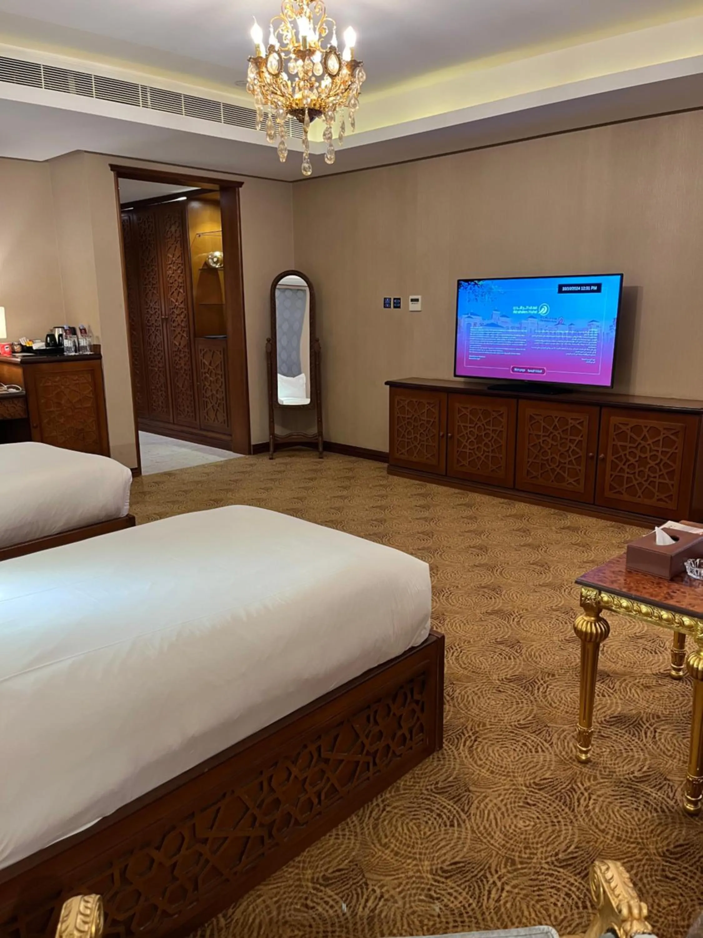 Communal lounge/ TV room, Bed in Al Rahden Hotel