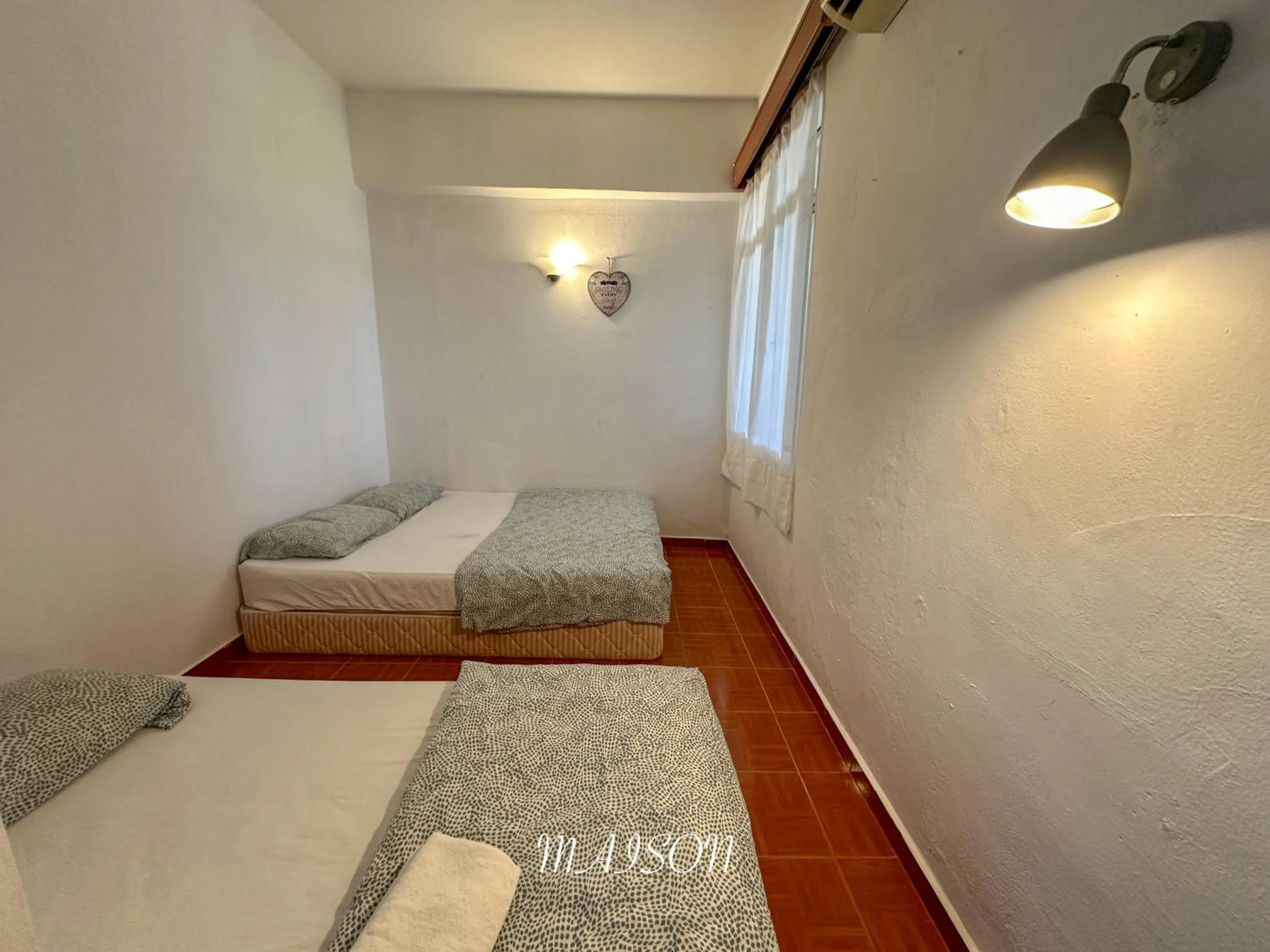 Bed in Maison Seaview Suites Port Dickson