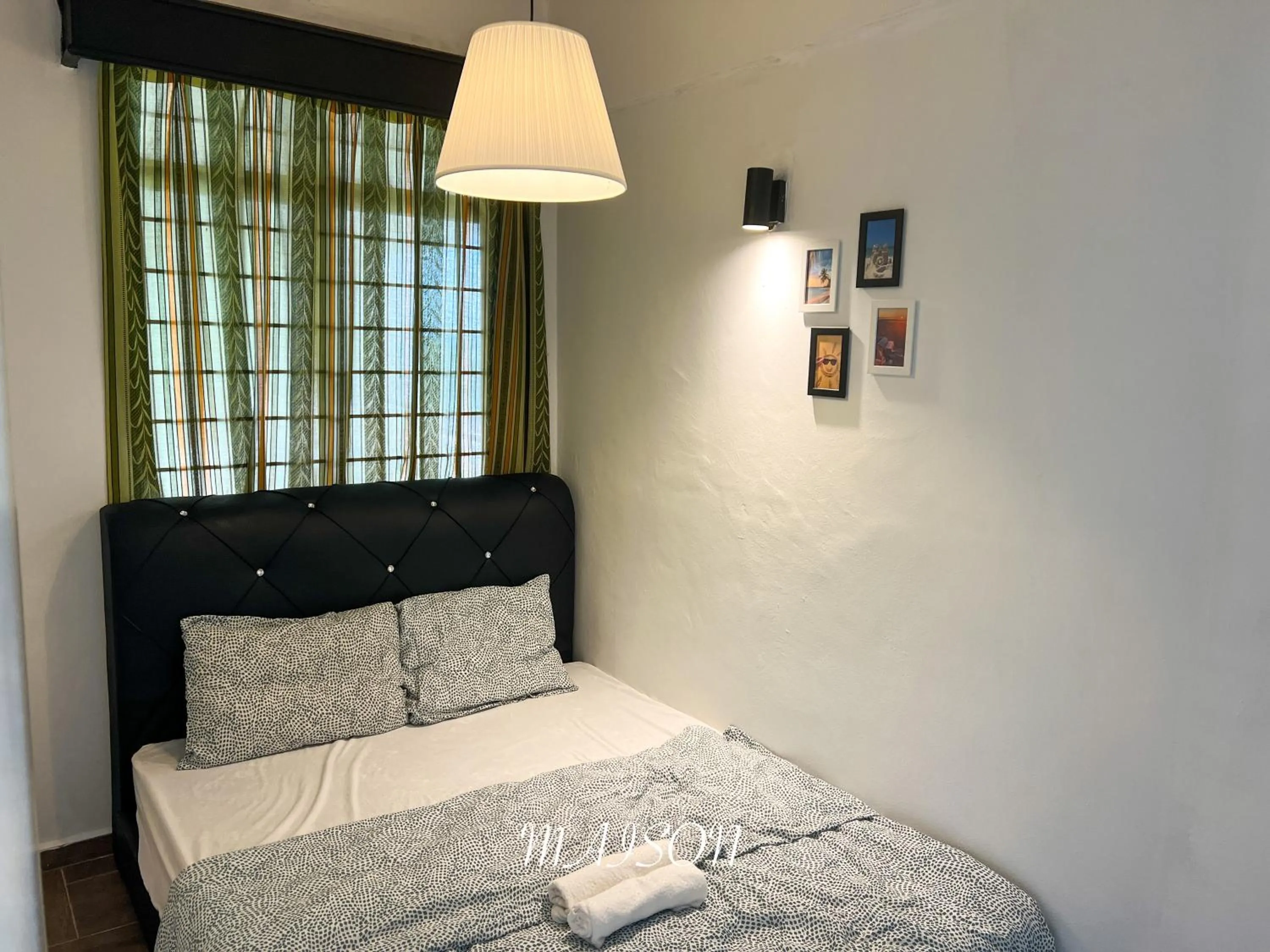 Bed in Maison Seaview Suites Port Dickson