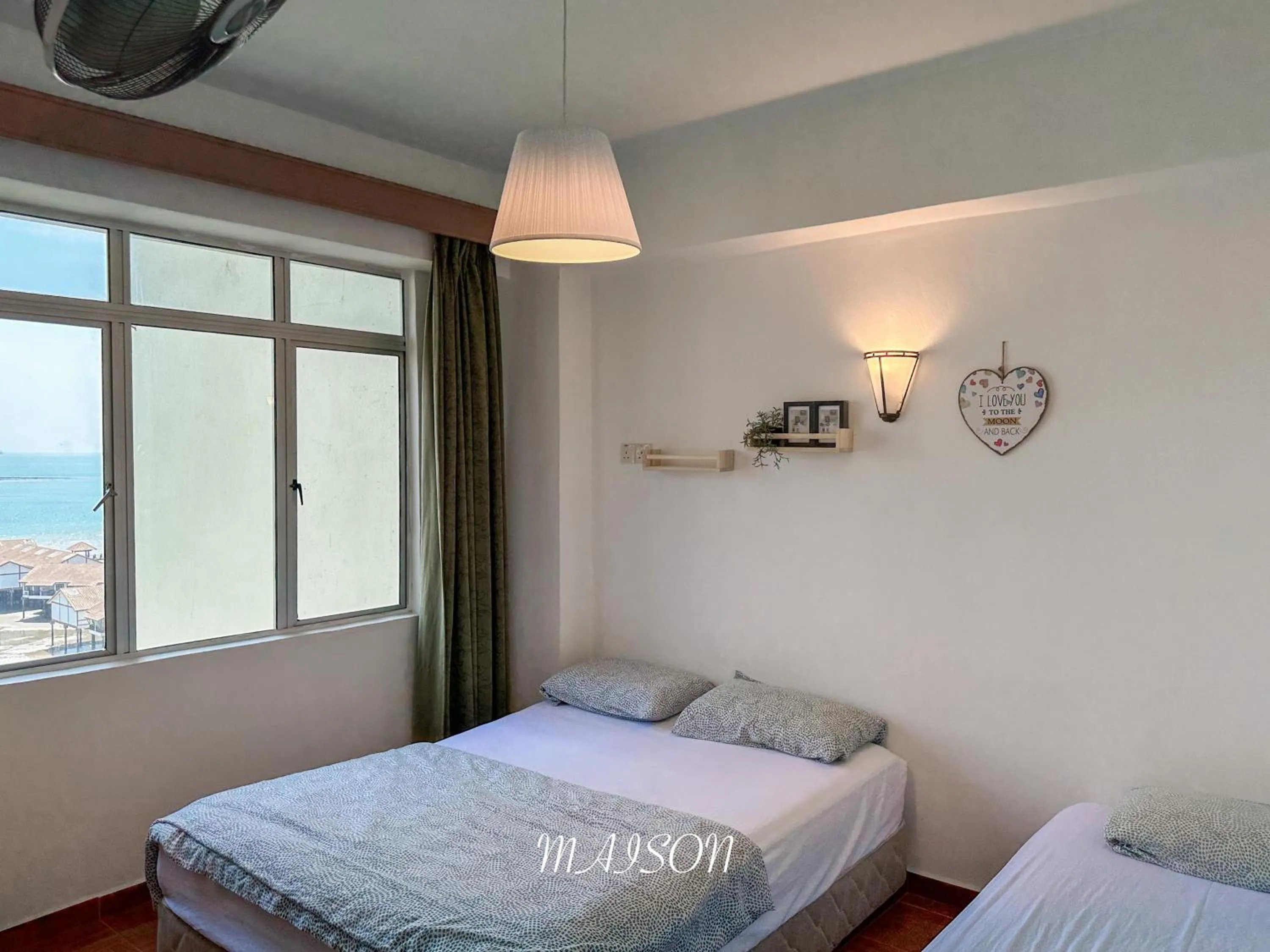 Bed in Maison Seaview Suites Port Dickson