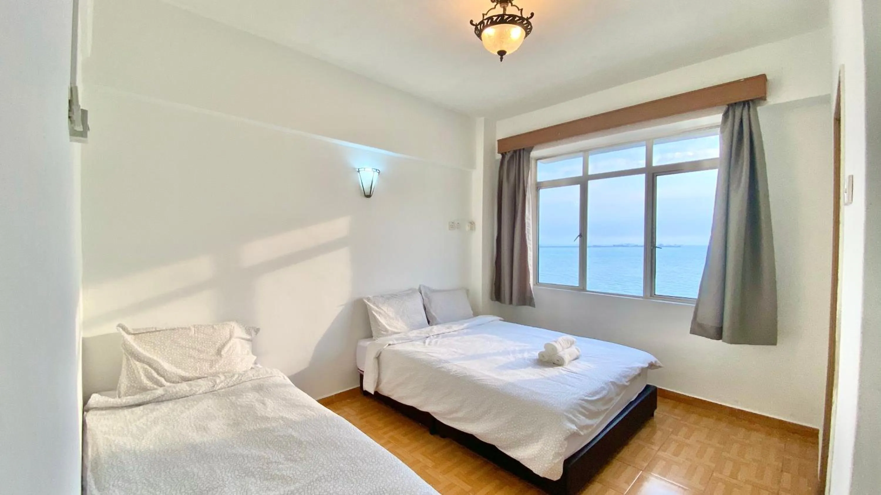 Bed in Maison Seaview Suites Port Dickson