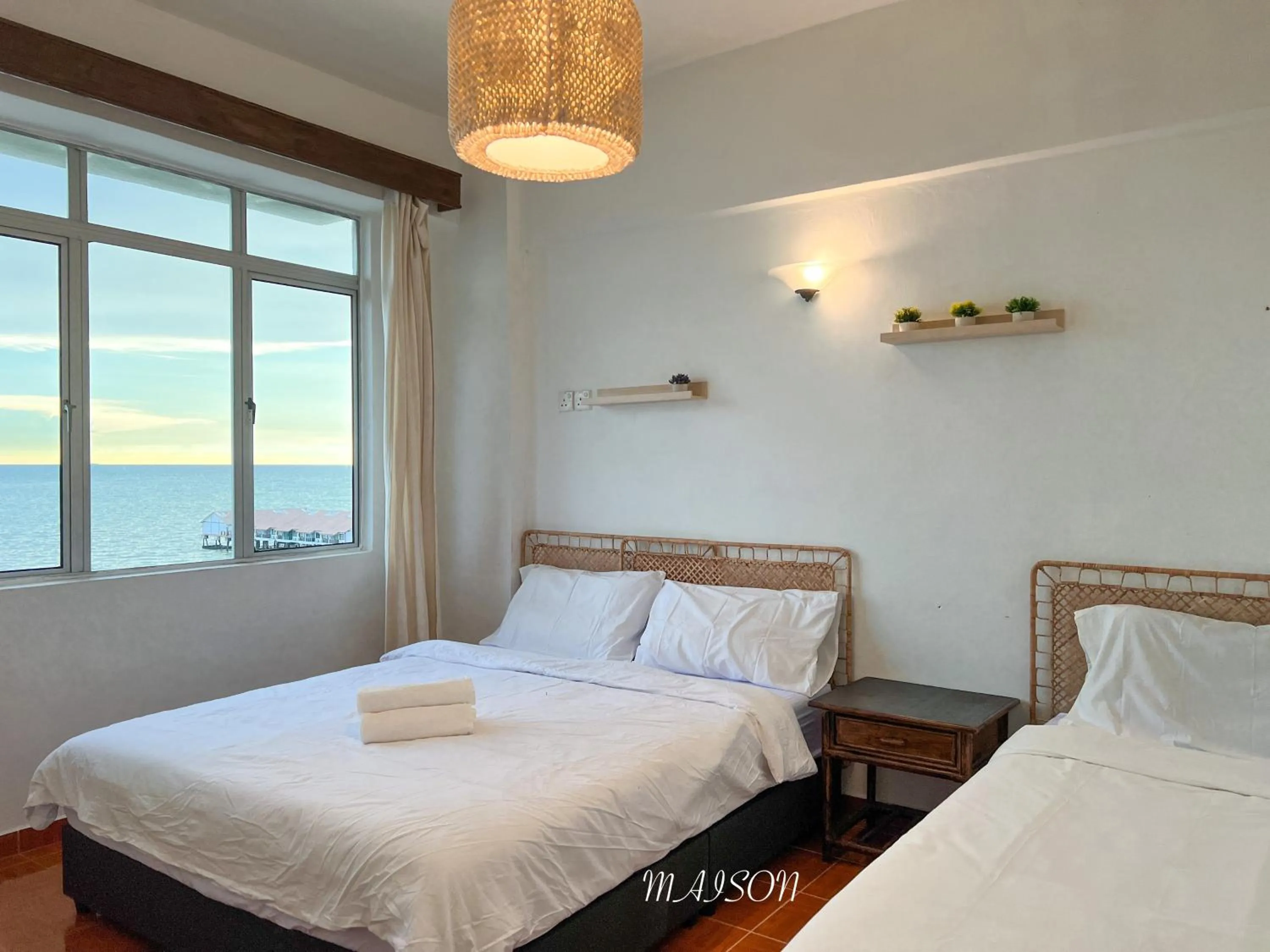 Bed in Maison Seaview Suites Port Dickson