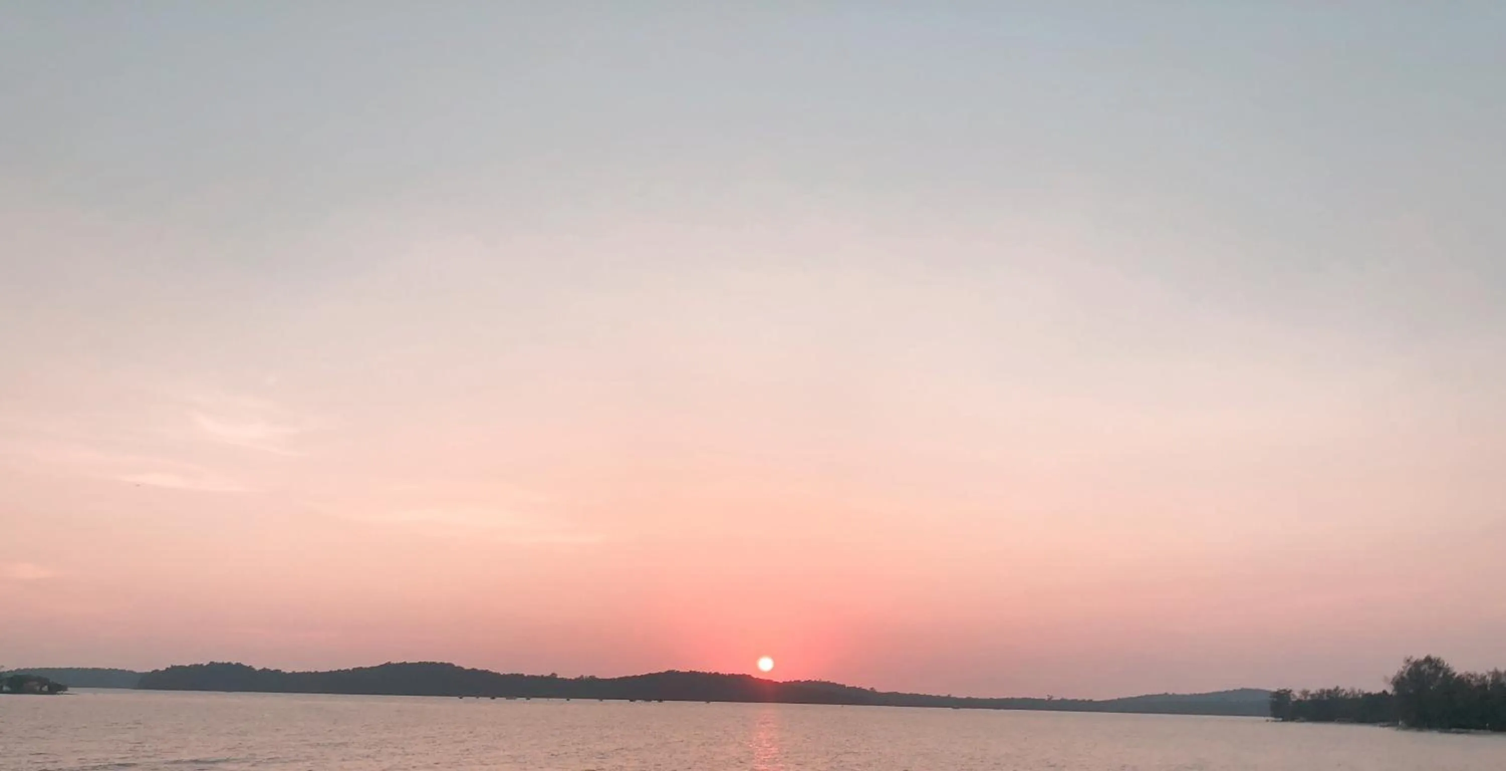 Sunset in Sealong Bay ZhongQi Conifer Hotel 海龙湾中启康年酒店