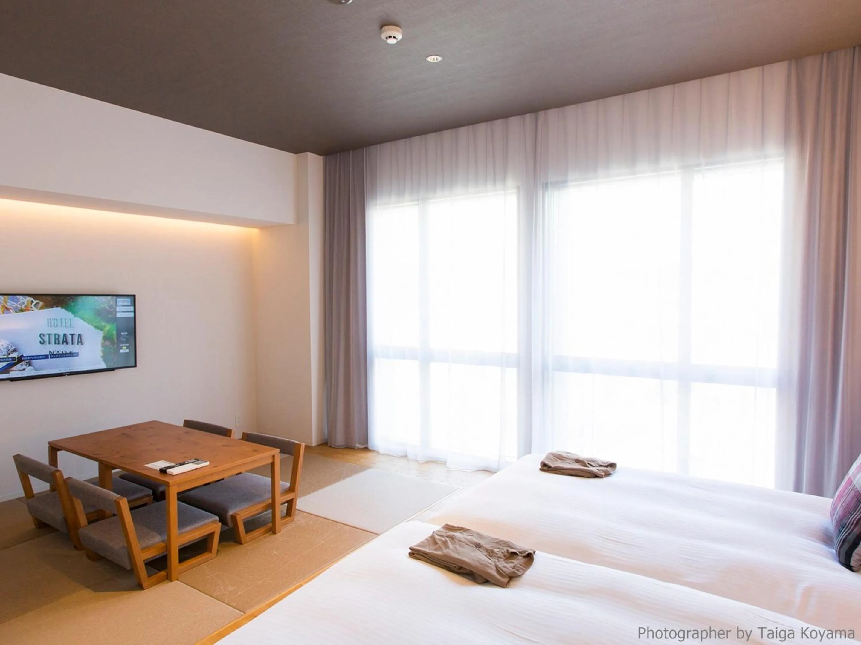 Text overlay, Bed in HOTEL STRATA NAHA