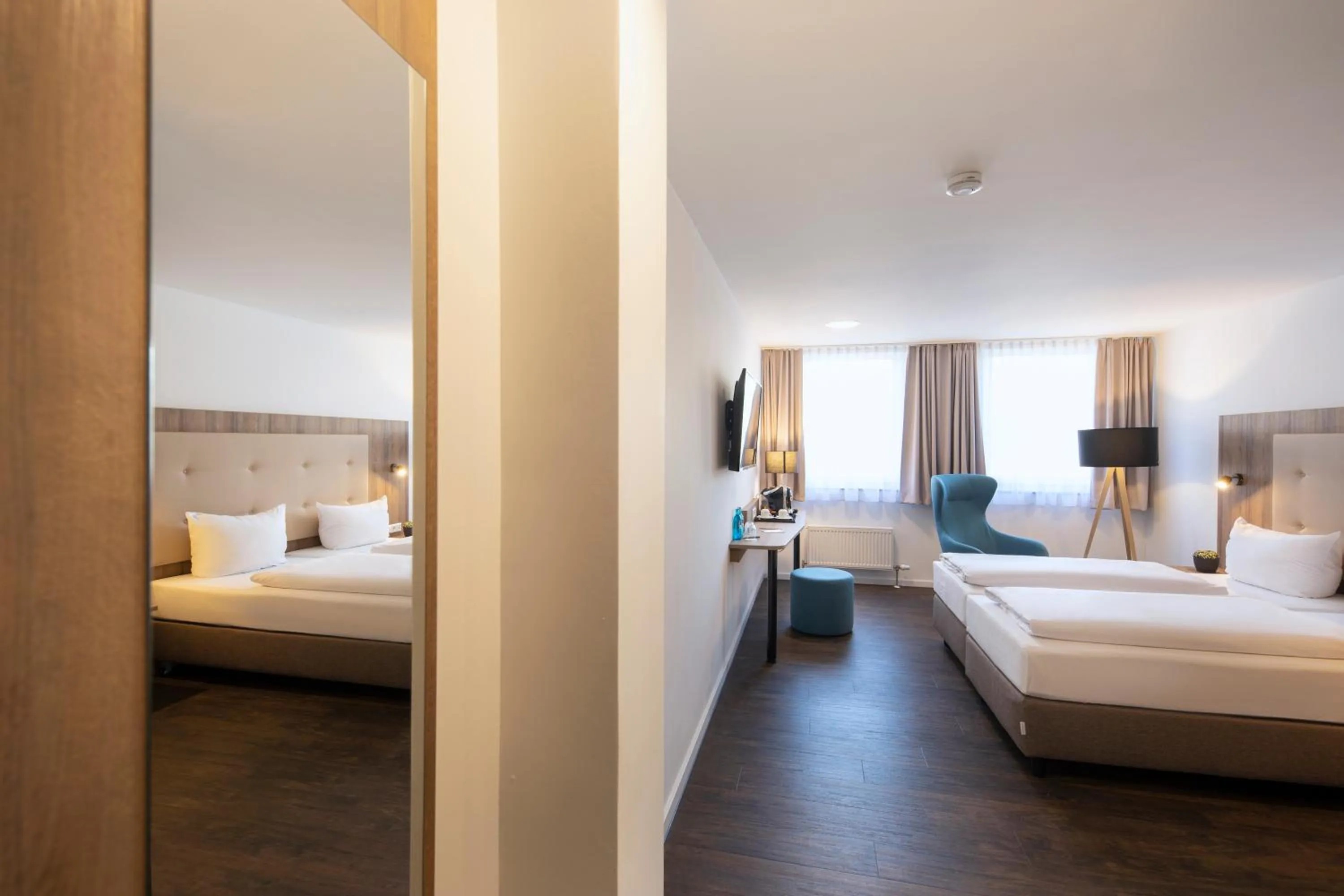 Photo of the whole room, Bed in ACHAT Hotel Stuttgart Zuffenhausen
