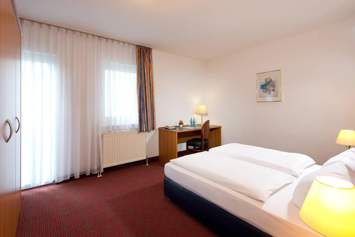 Bed in ACHAT Hotel Darmstadt Griesheim