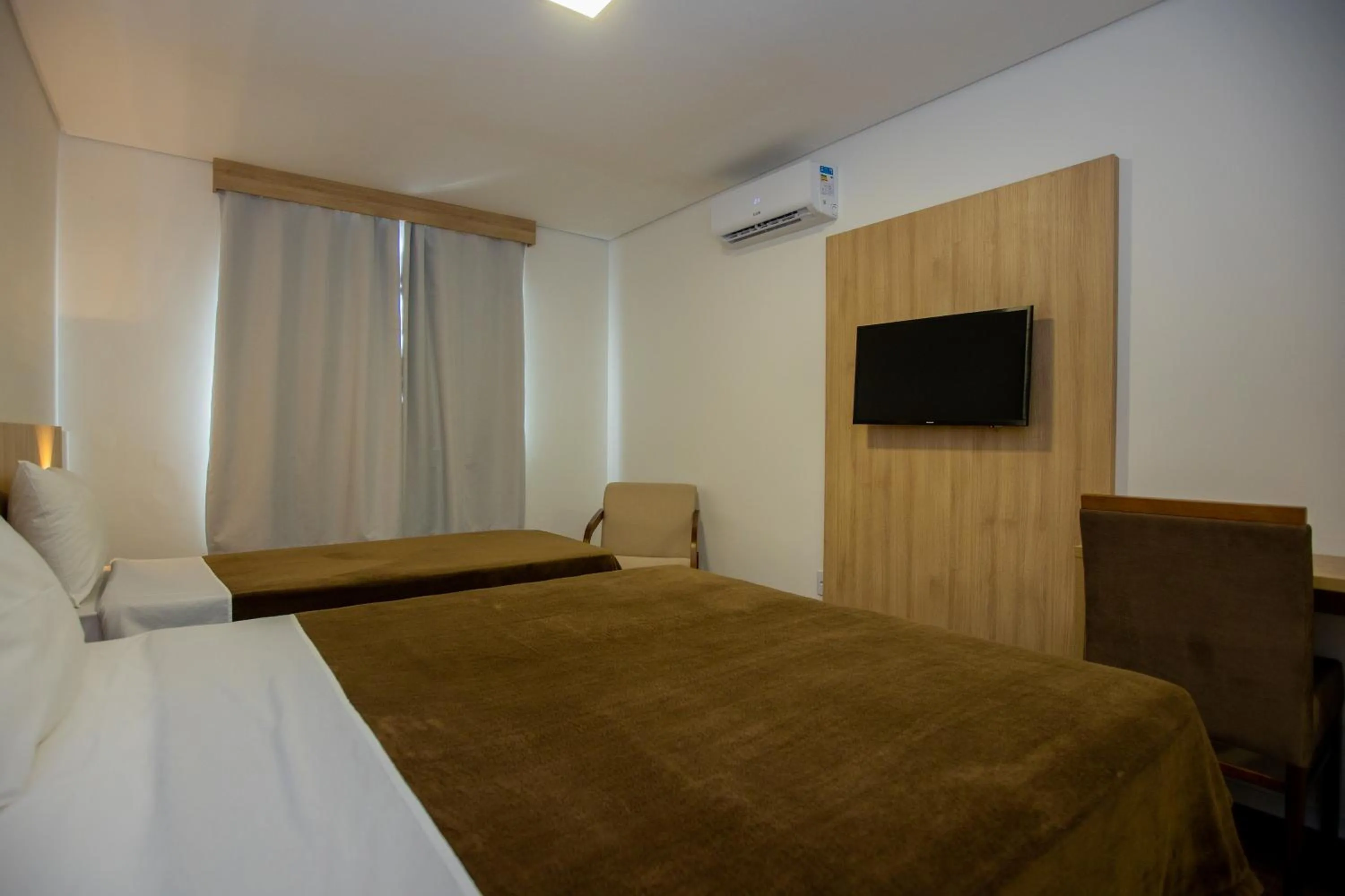 Bed in Tri Hotel Chapecó