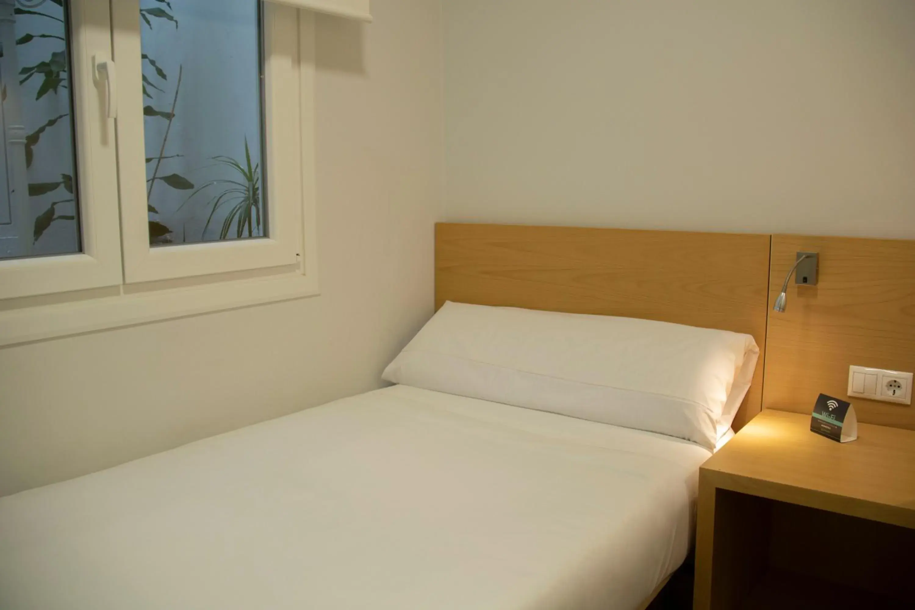 Bed in Alda Alborán Rooms Bed in Alda Alborán Rooms