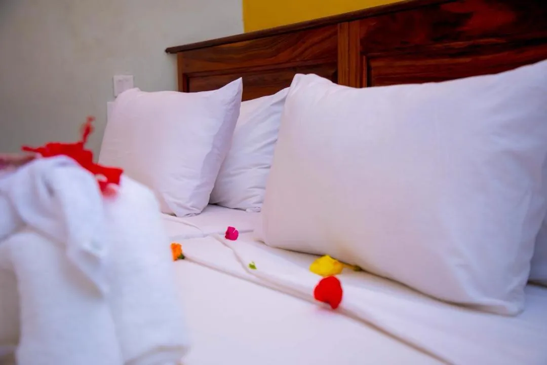 Bed in Tropic Garden Hotel