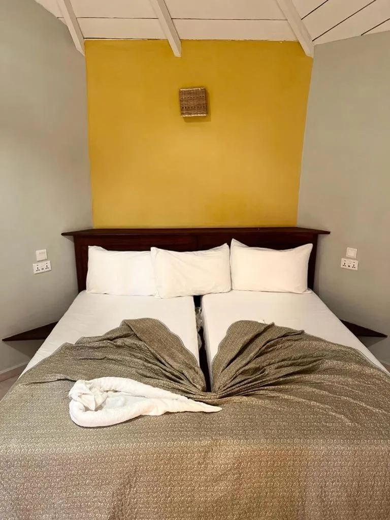 Bed in Tropic Garden Hotel