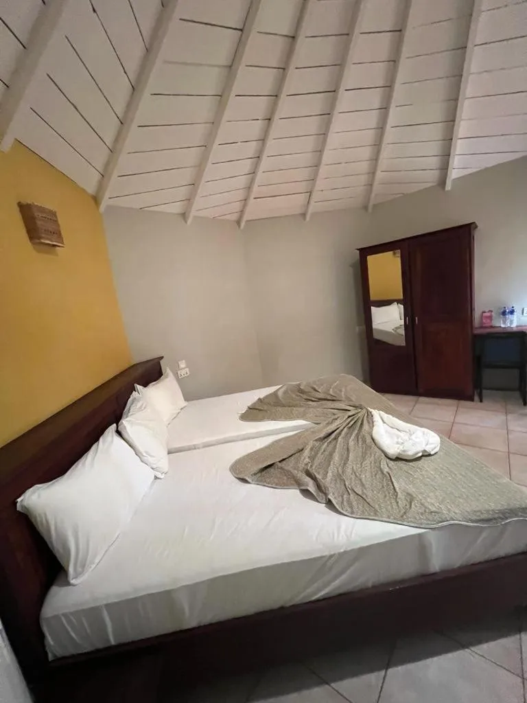 Bed in Tropic Garden Hotel