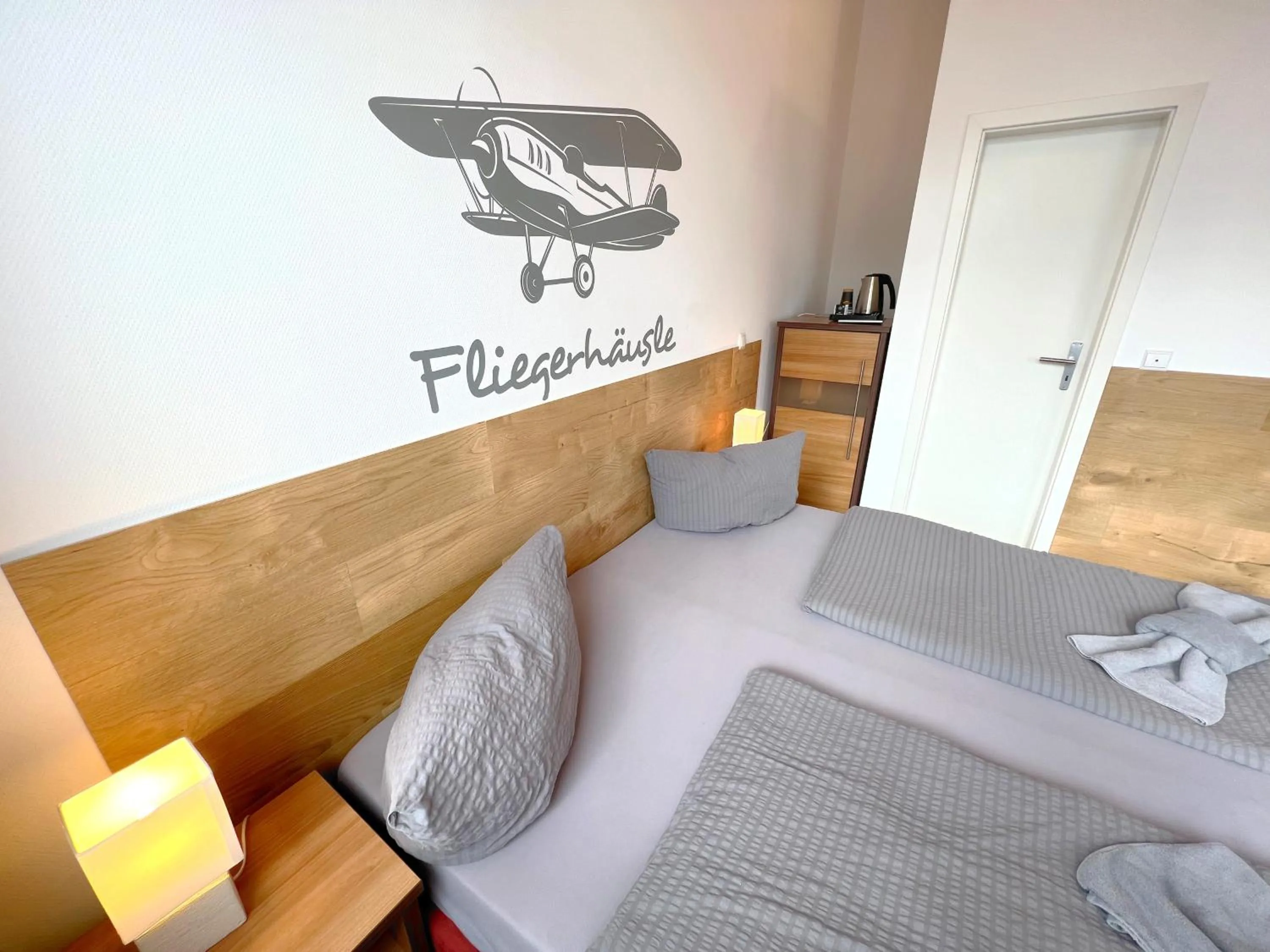 Photo of the whole room, Bed in BnB Fliegerhaeusle Hagnau 24h Self Check In