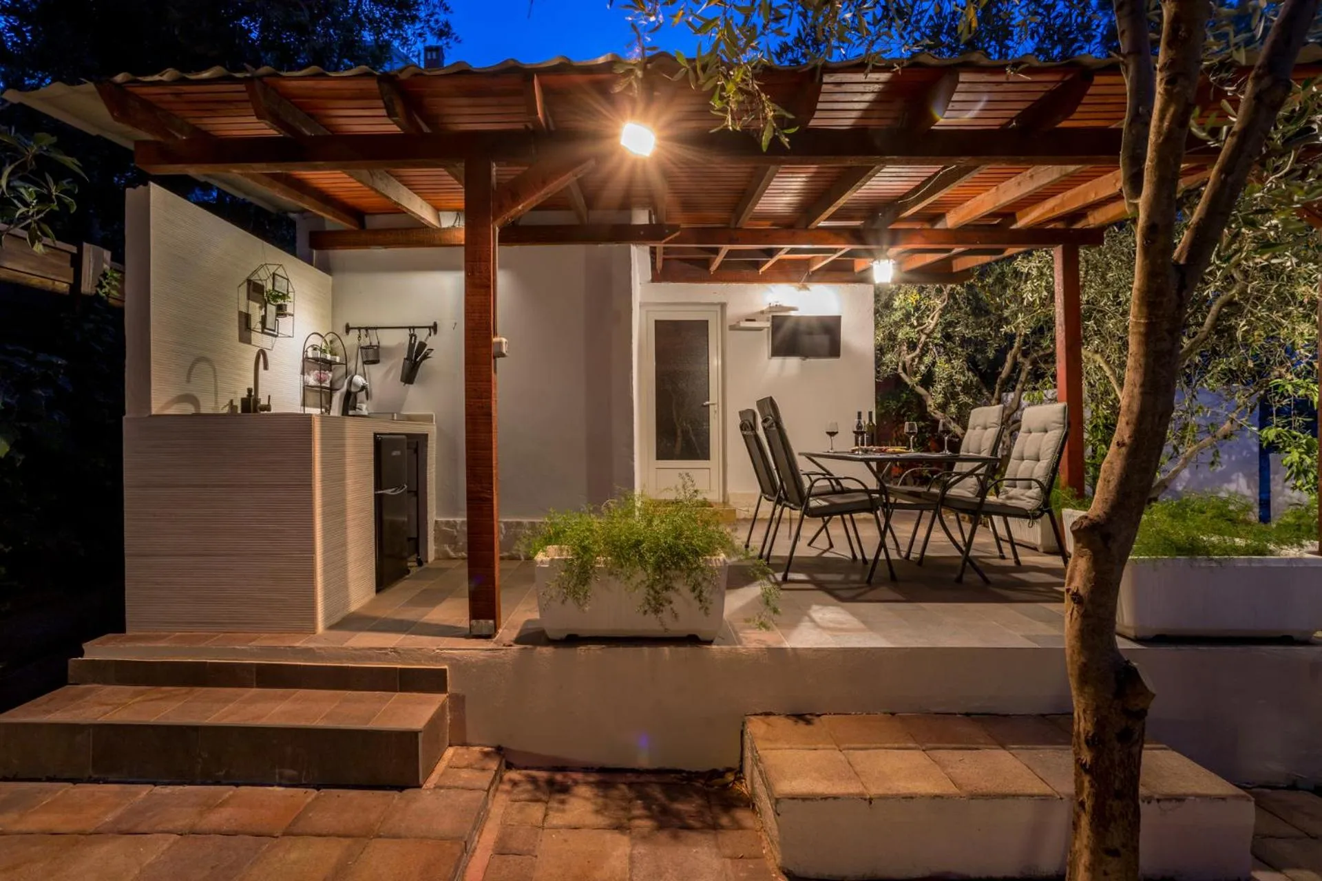 House with big walled oliva garden