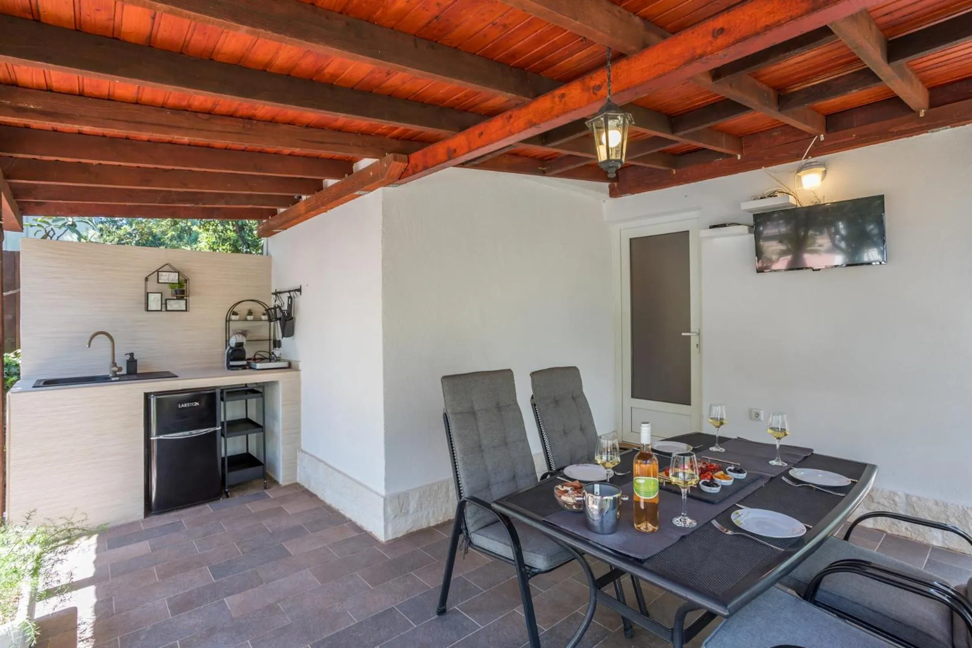 Dining Area in House with big walled oliva garden