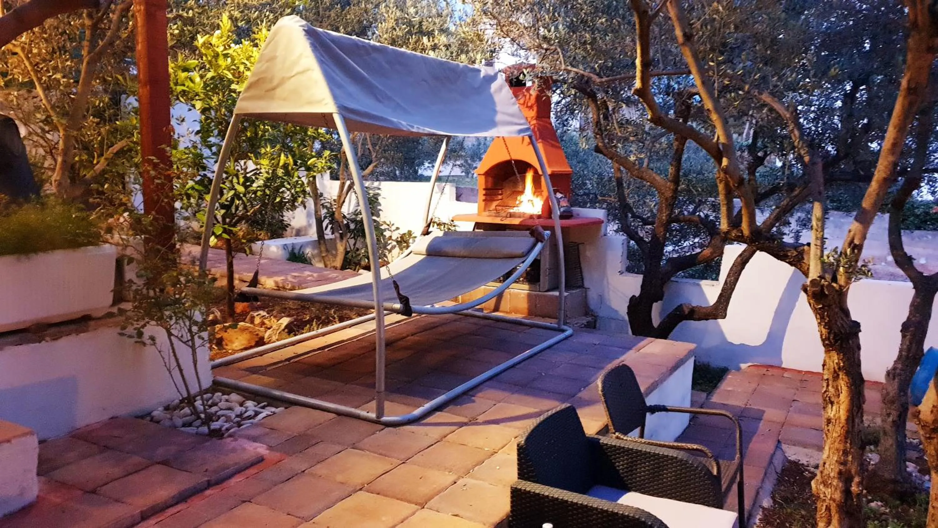 furniture in House with big walled oliva garden