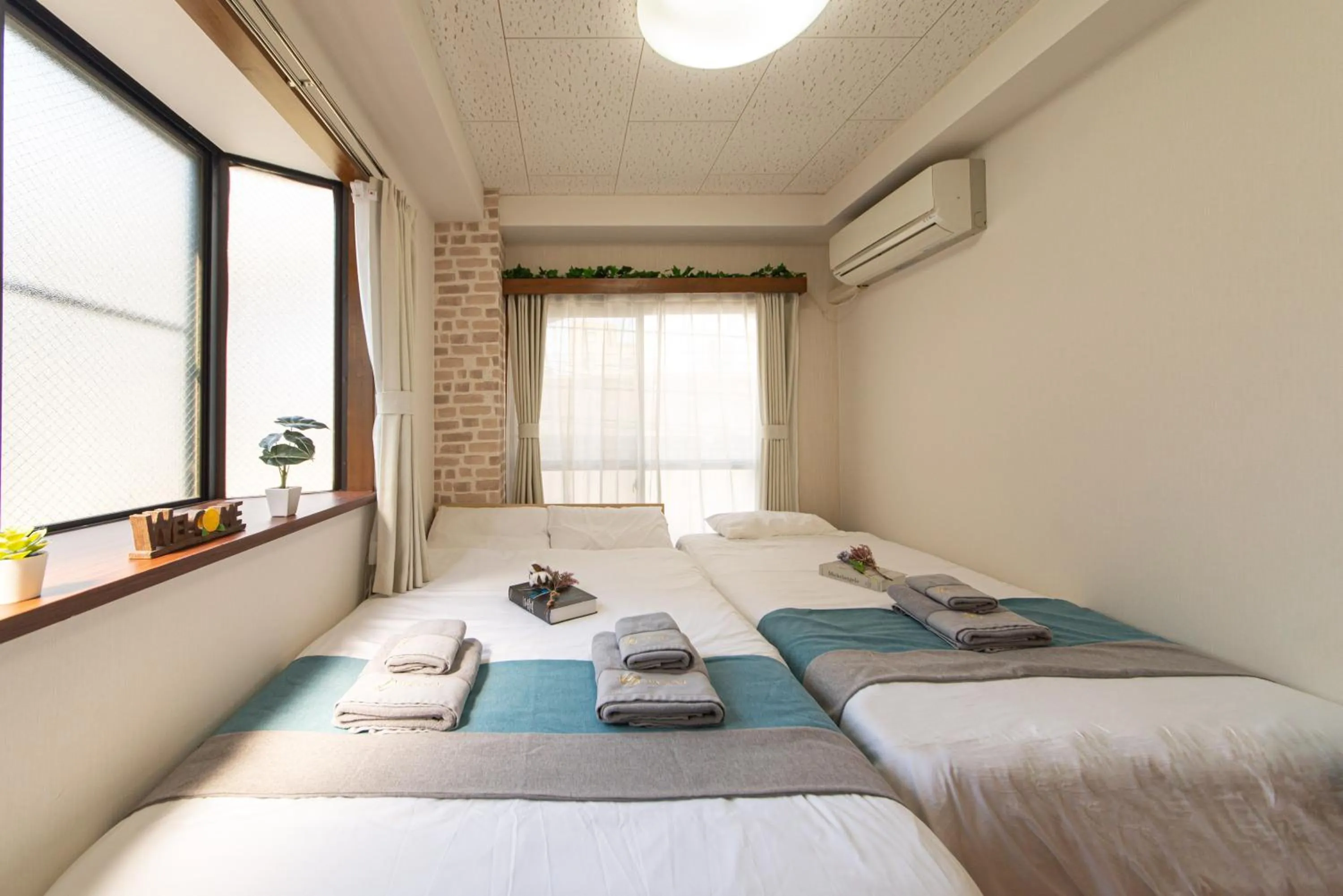 Bed in nestay suite tokyo tabata