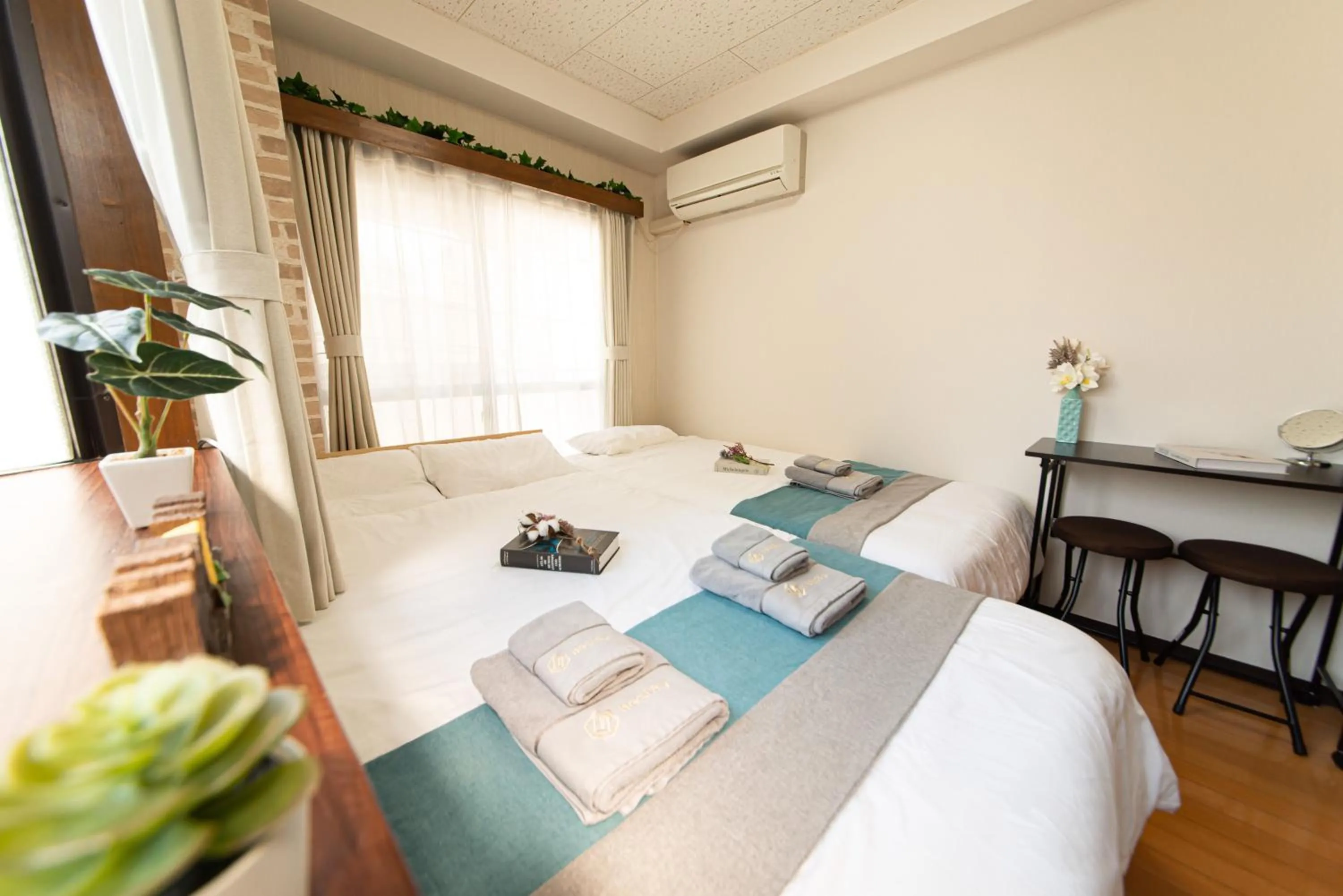 Bed in nestay suite tokyo tabata