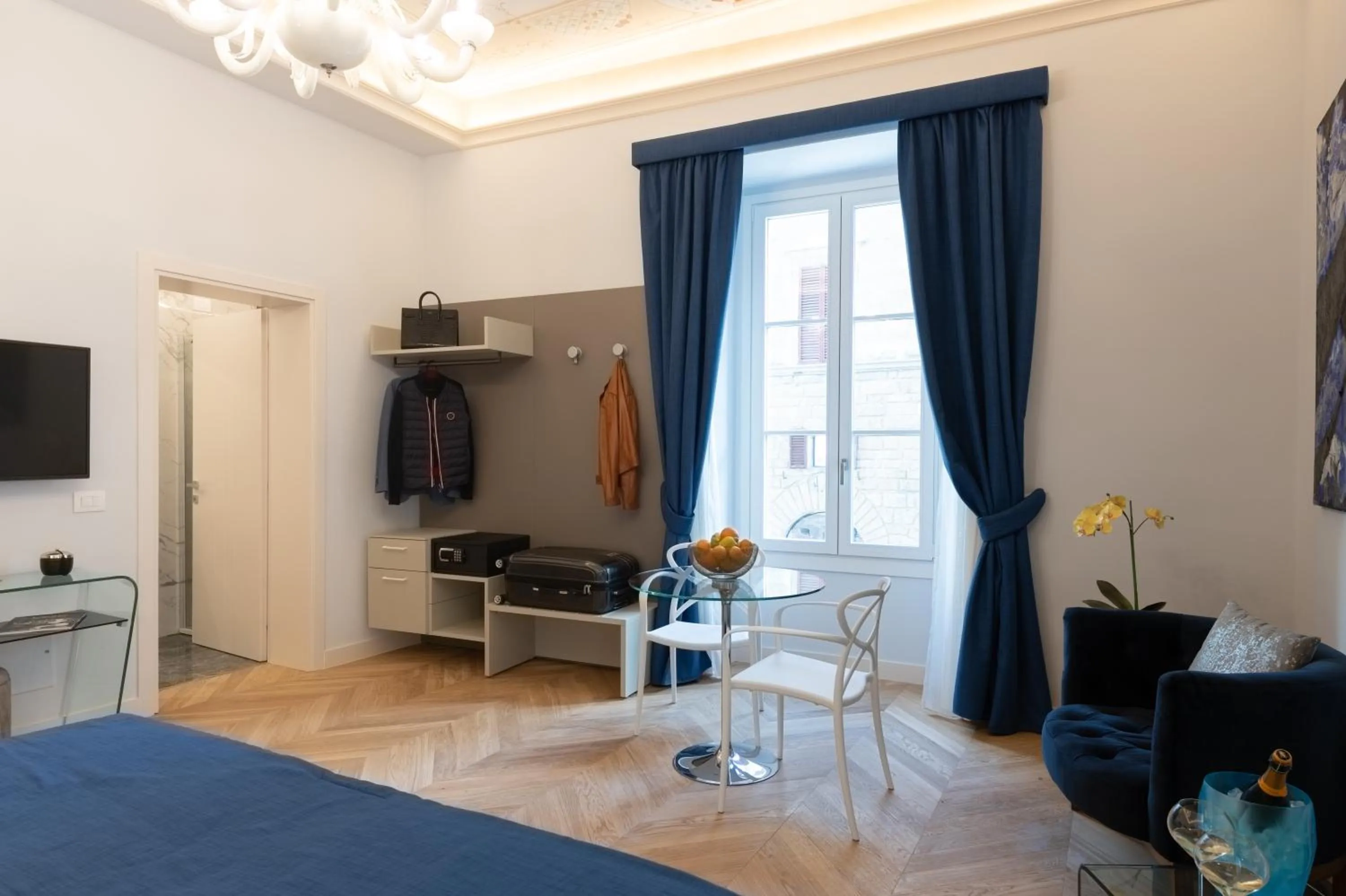 Seating area, Bed in Kairos by Florence Art Apartments