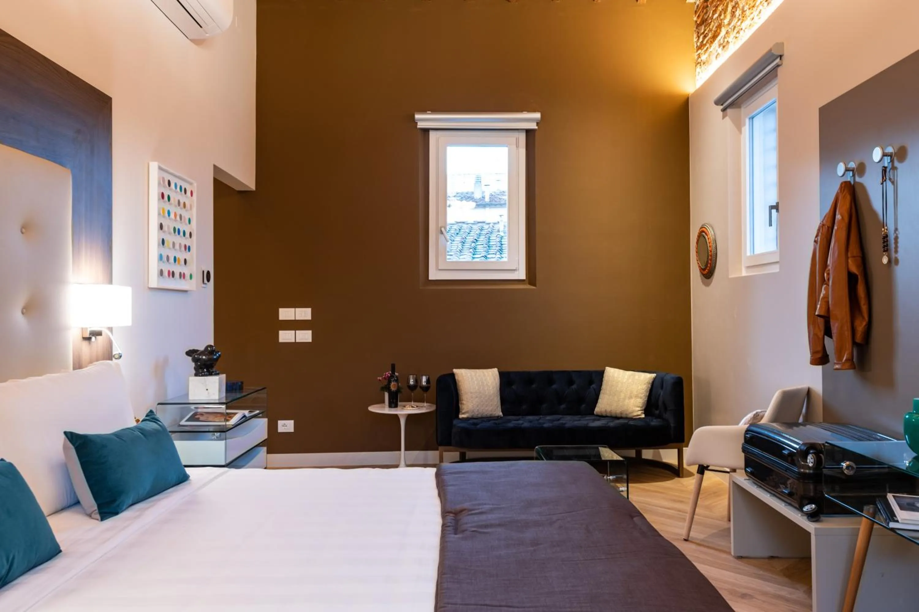 Seating area, Bed in Kairos by Florence Art Apartments