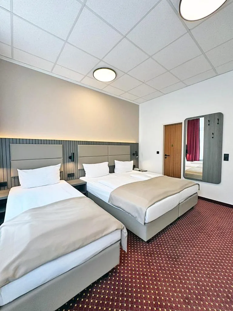 Bed in Hotel Lumen am Hauptbahnhof