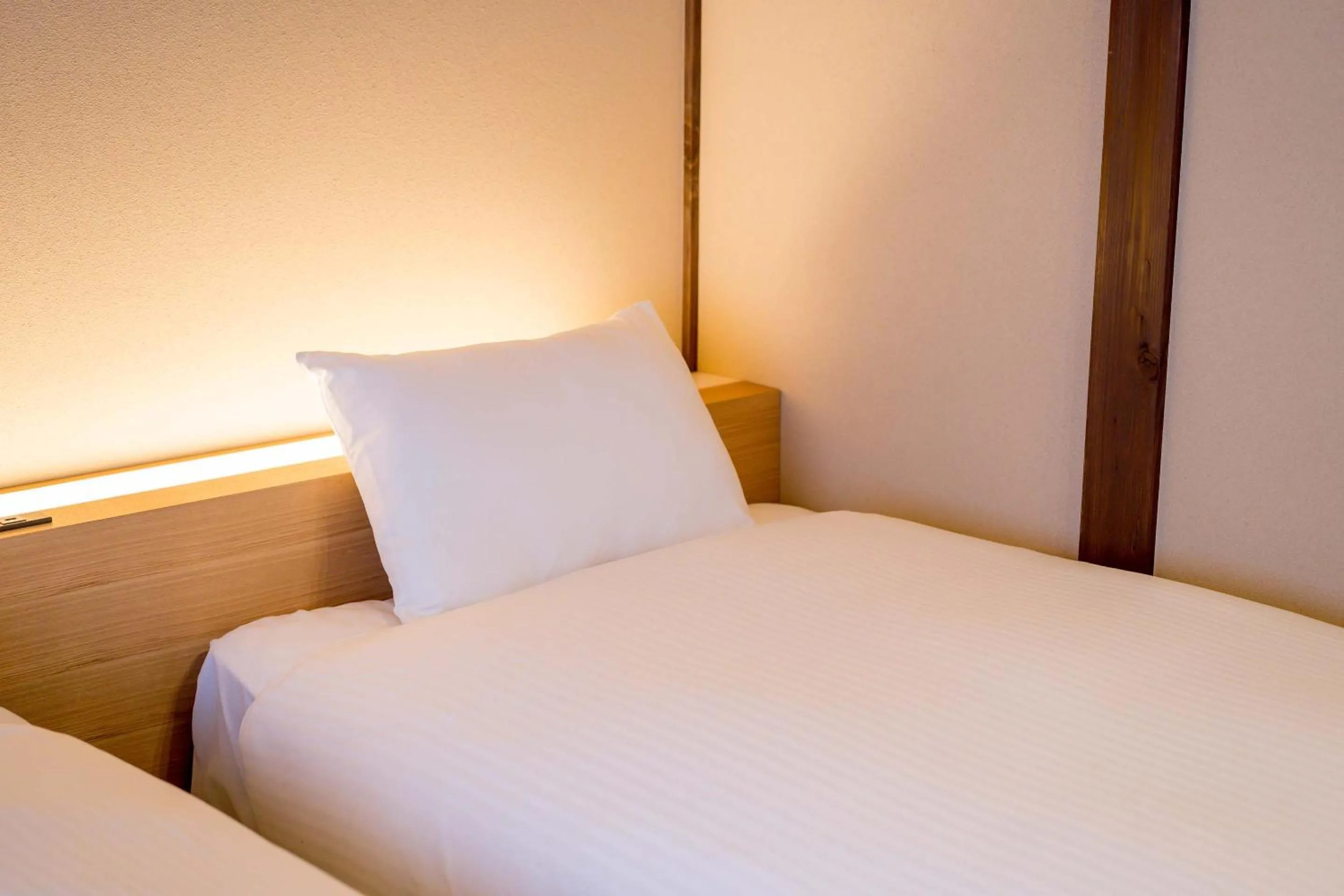 Bed in RESI STAY Villa Silktree