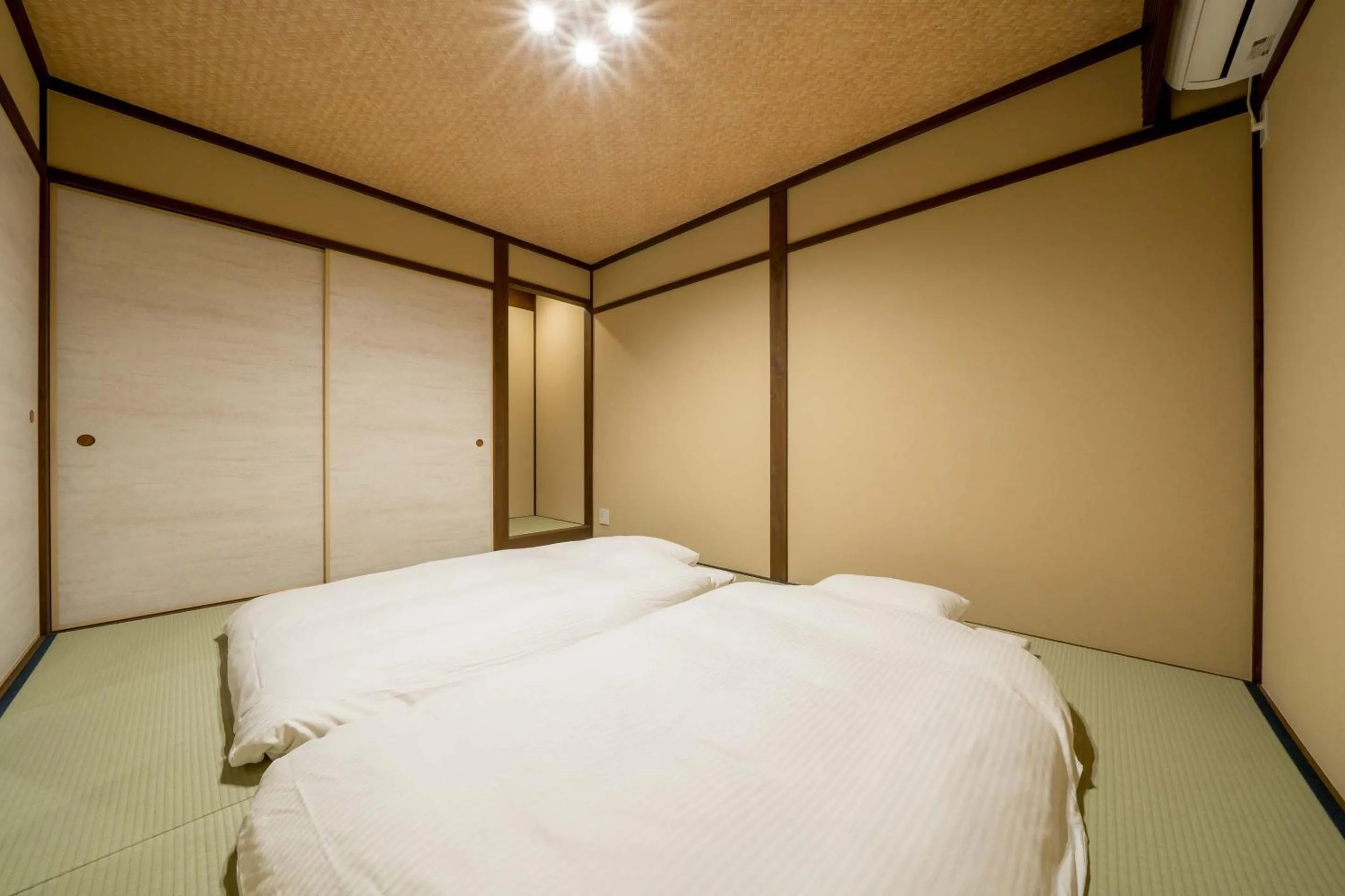 Bed in RESI STAY Villa Silktree