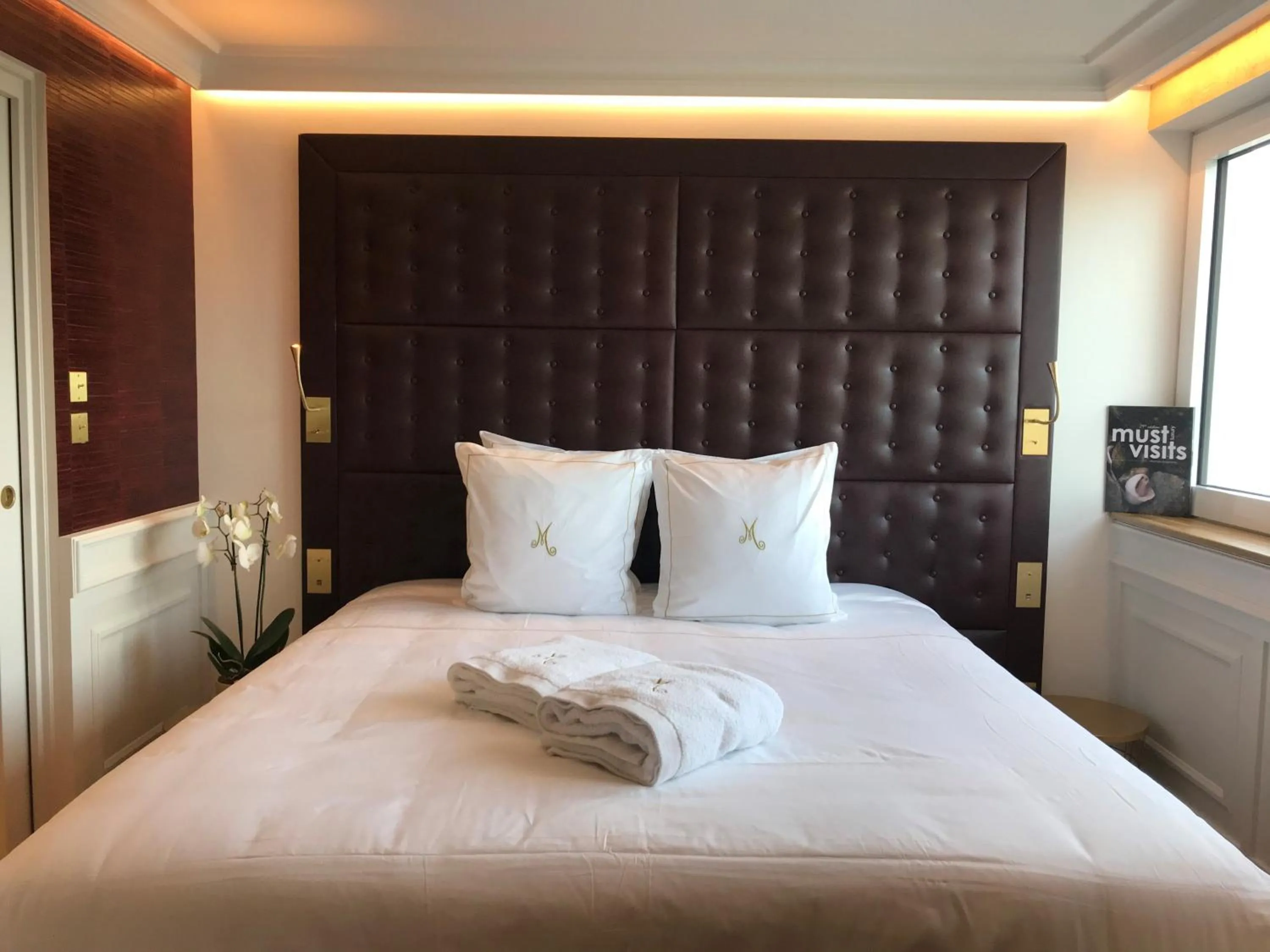 Bed in Hôtel Merveilleux Côté Mer