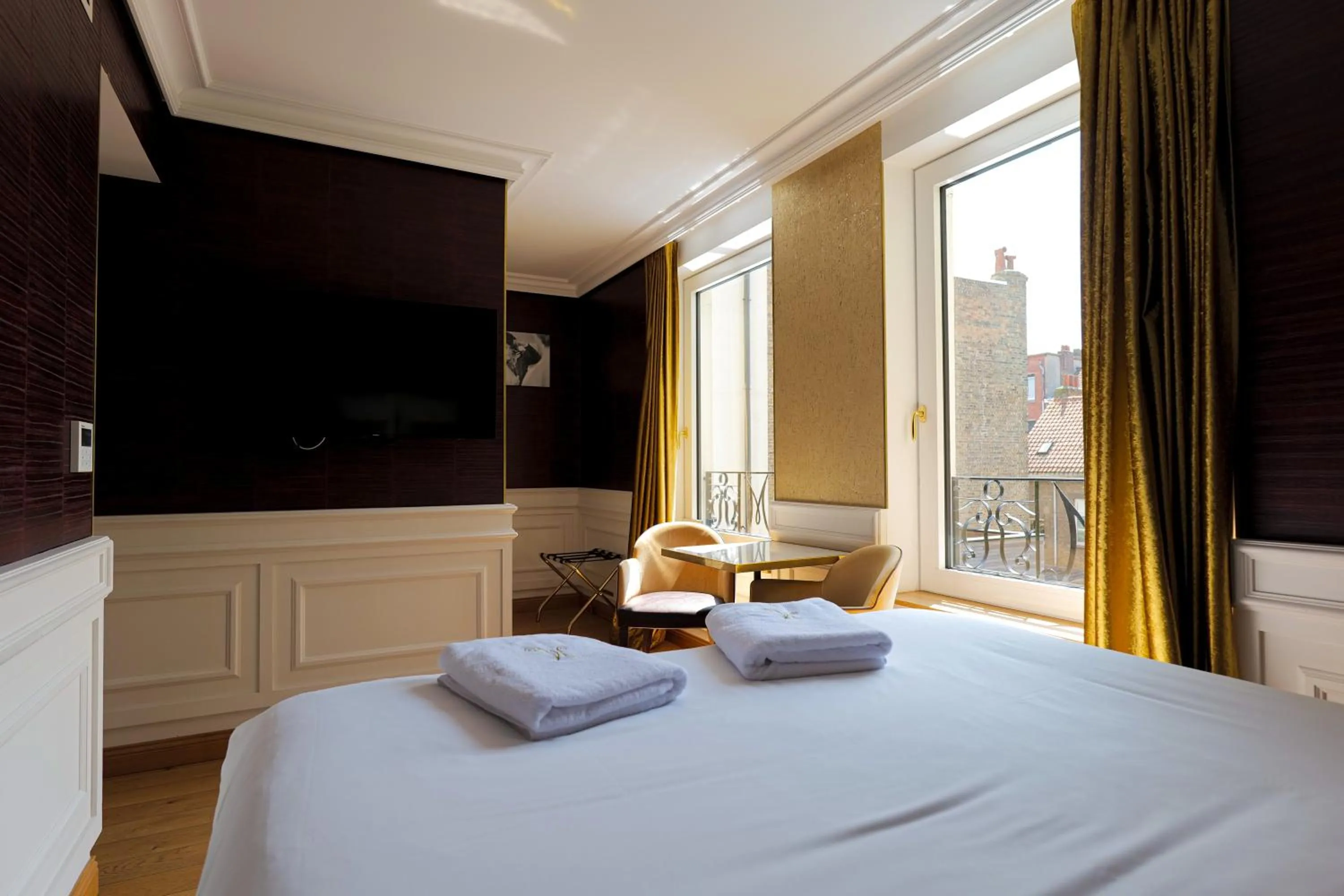 Bed in Hôtel Merveilleux Côté Mer