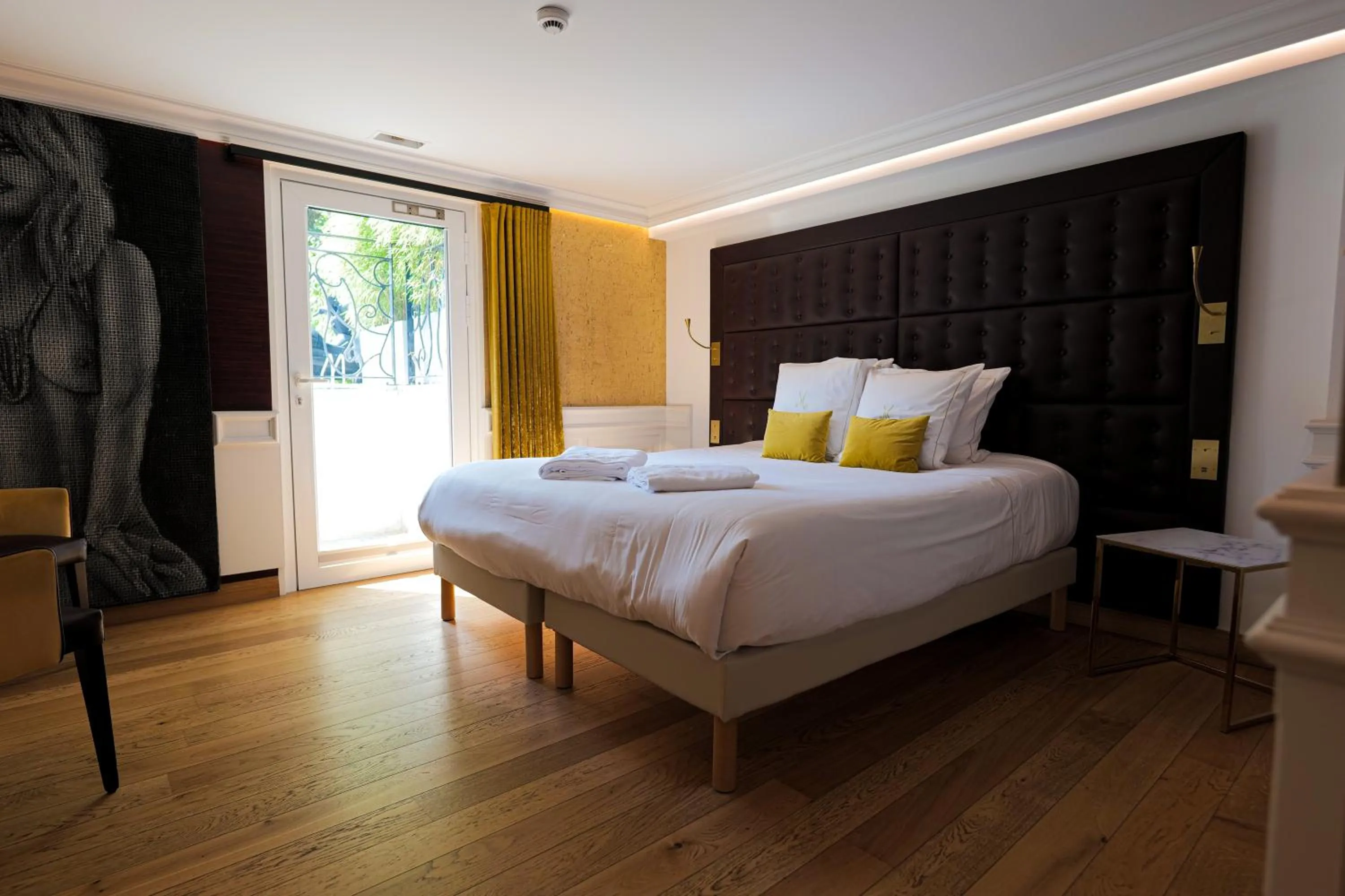 Bed in Hôtel Merveilleux Côté Mer