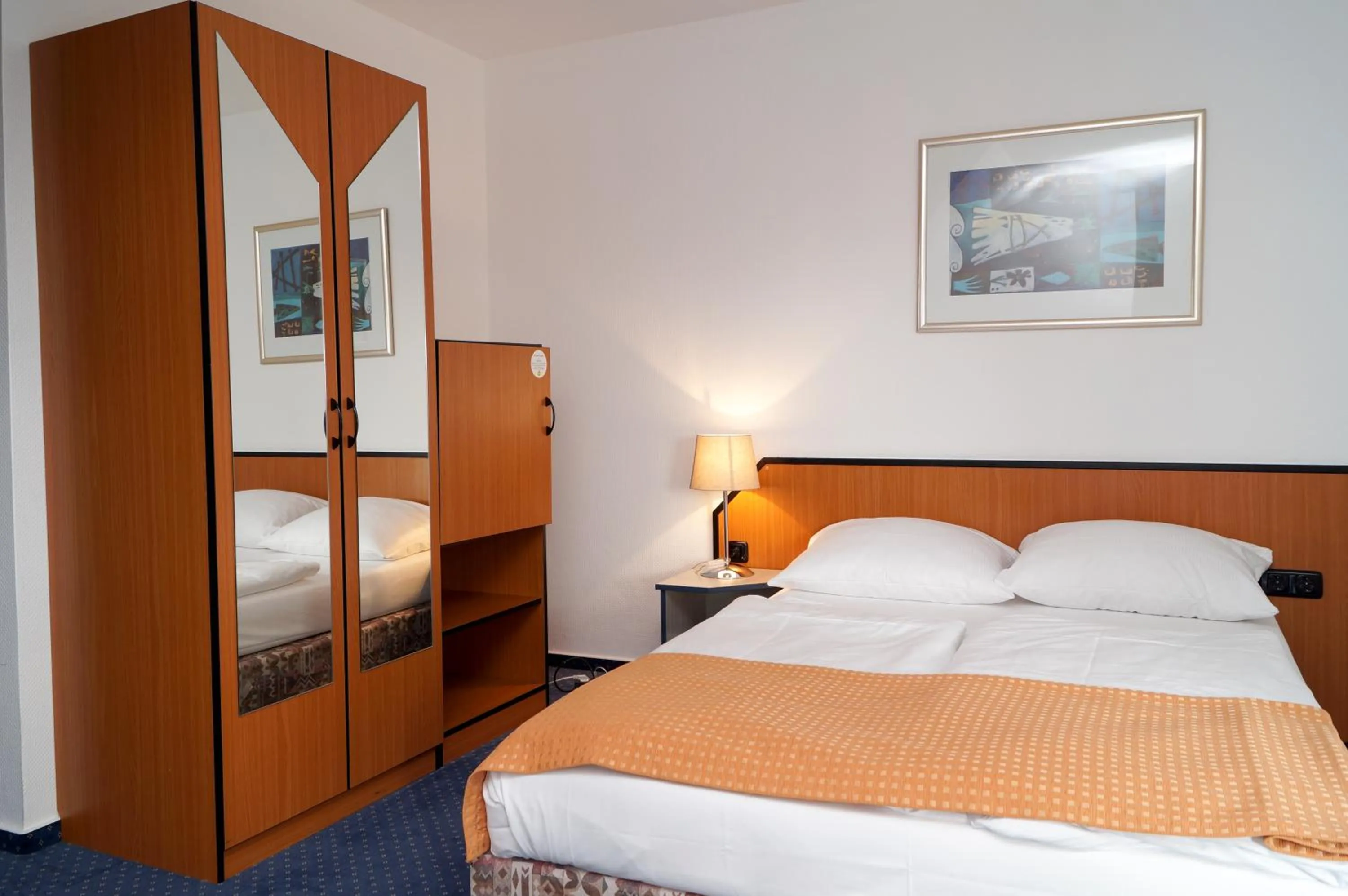 Bed in Trip Inn Kongresshotel Frankfurt-Rodgau