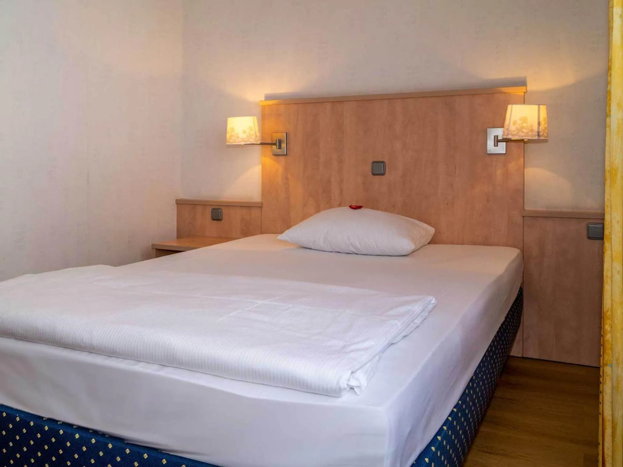 Bed in Trip Inn Kongresshotel Frankfurt-Rodgau
