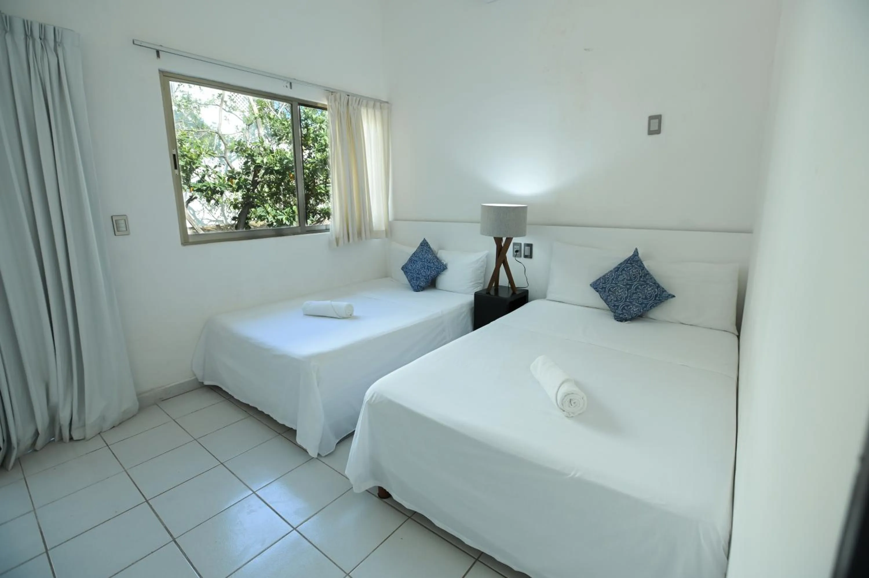 Bed in Kinta Kan Cabañas Hotel Playa del Carmen