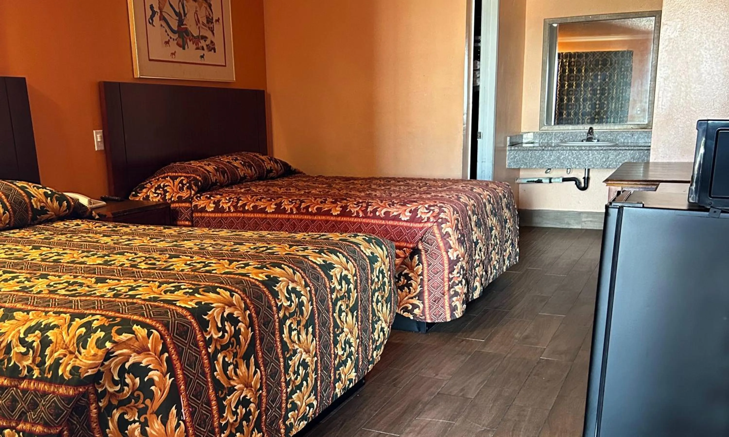 Bedroom in Heritage inn and suites