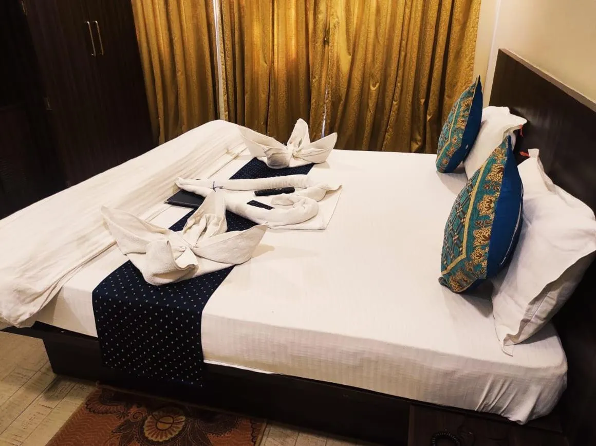 Bed in Hotel Manasi Royal