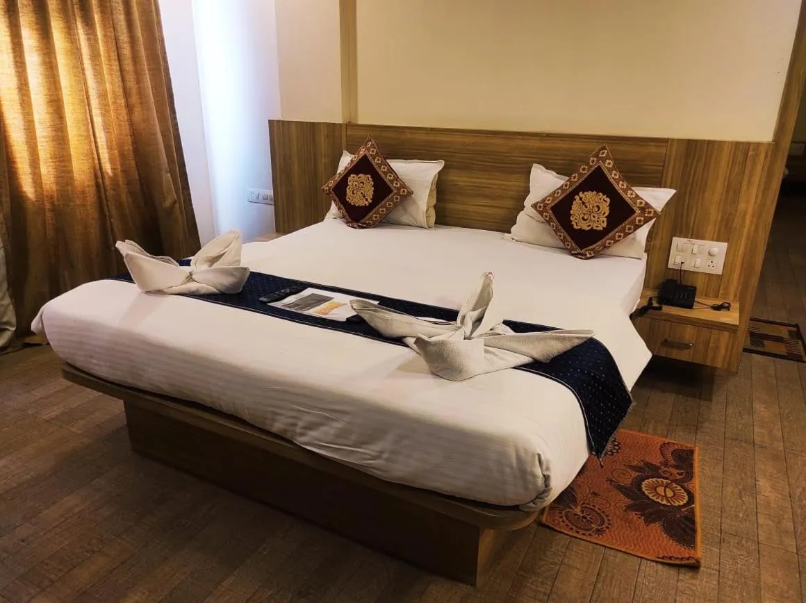 Bed in Hotel Manasi Royal