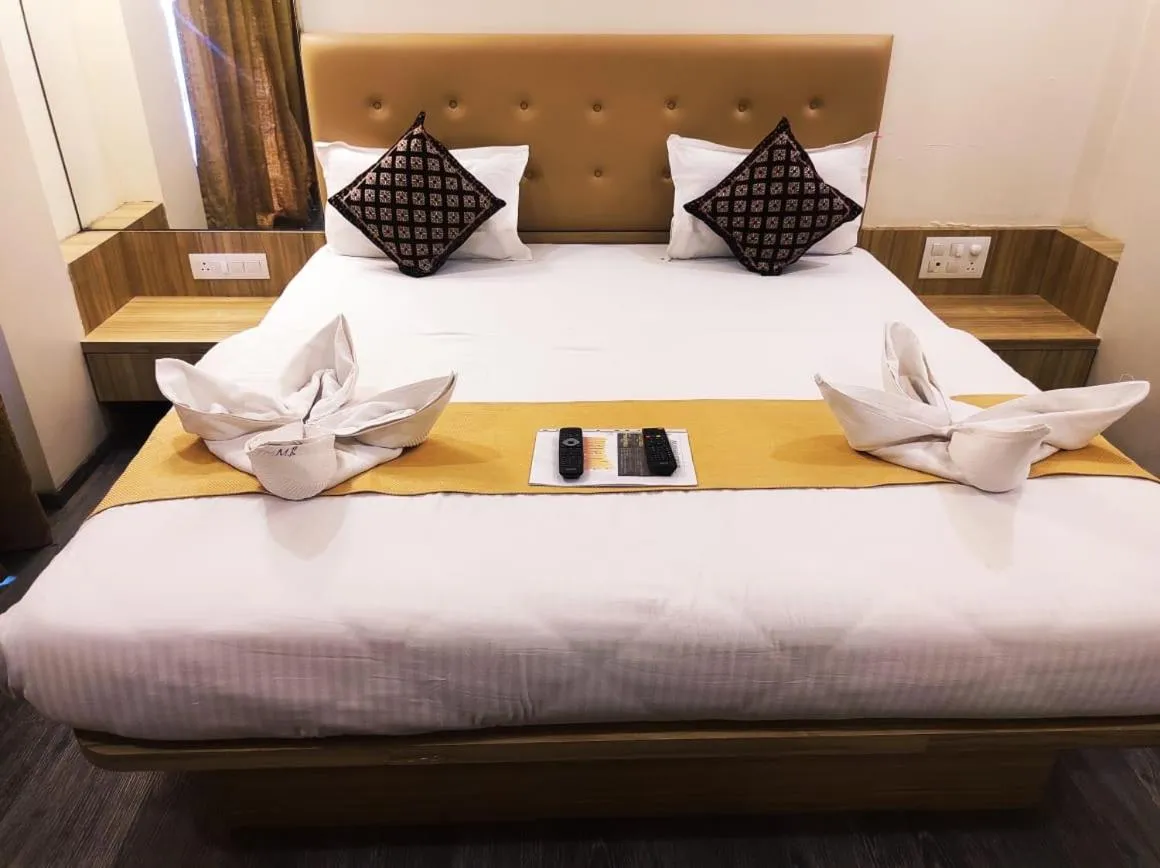 Bed in Hotel Manasi Royal