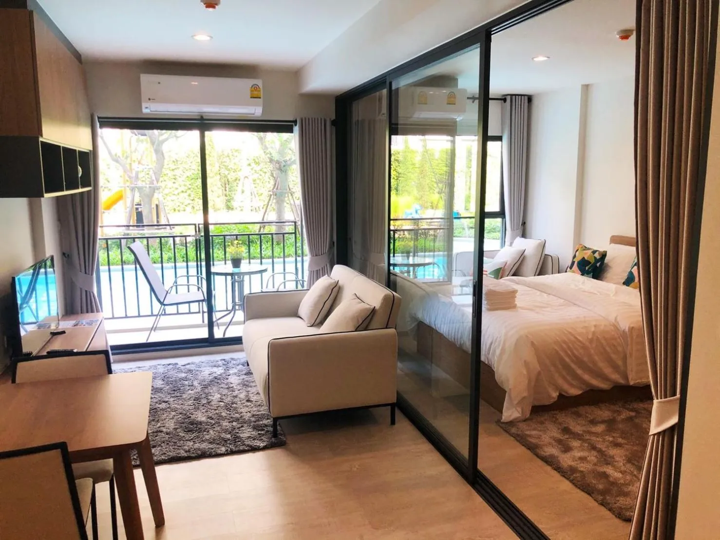 Photo of the whole room, Bed in La Casita pool access condo HuaHin