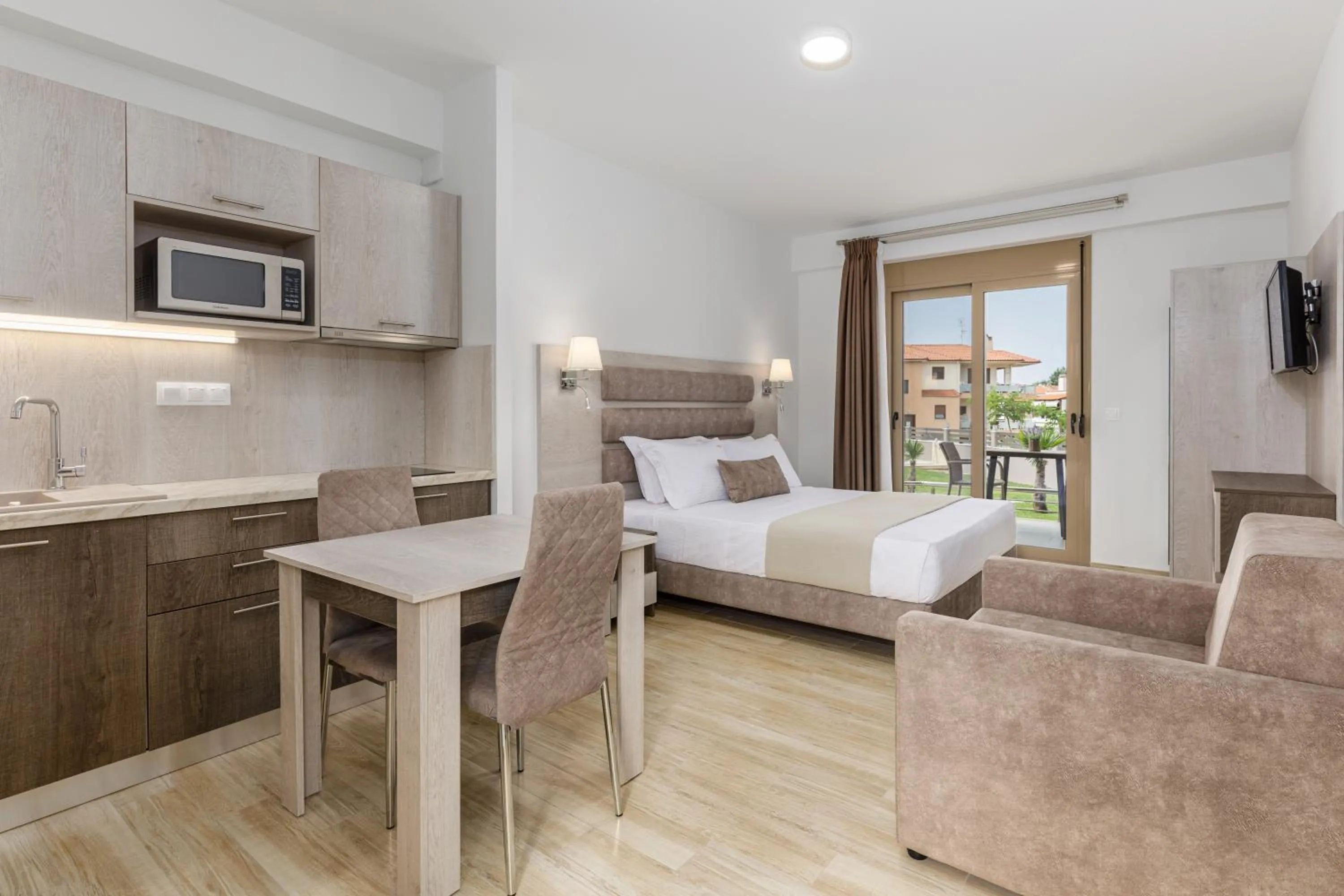 Photo of the whole room, Bed in Aria Garden Suites