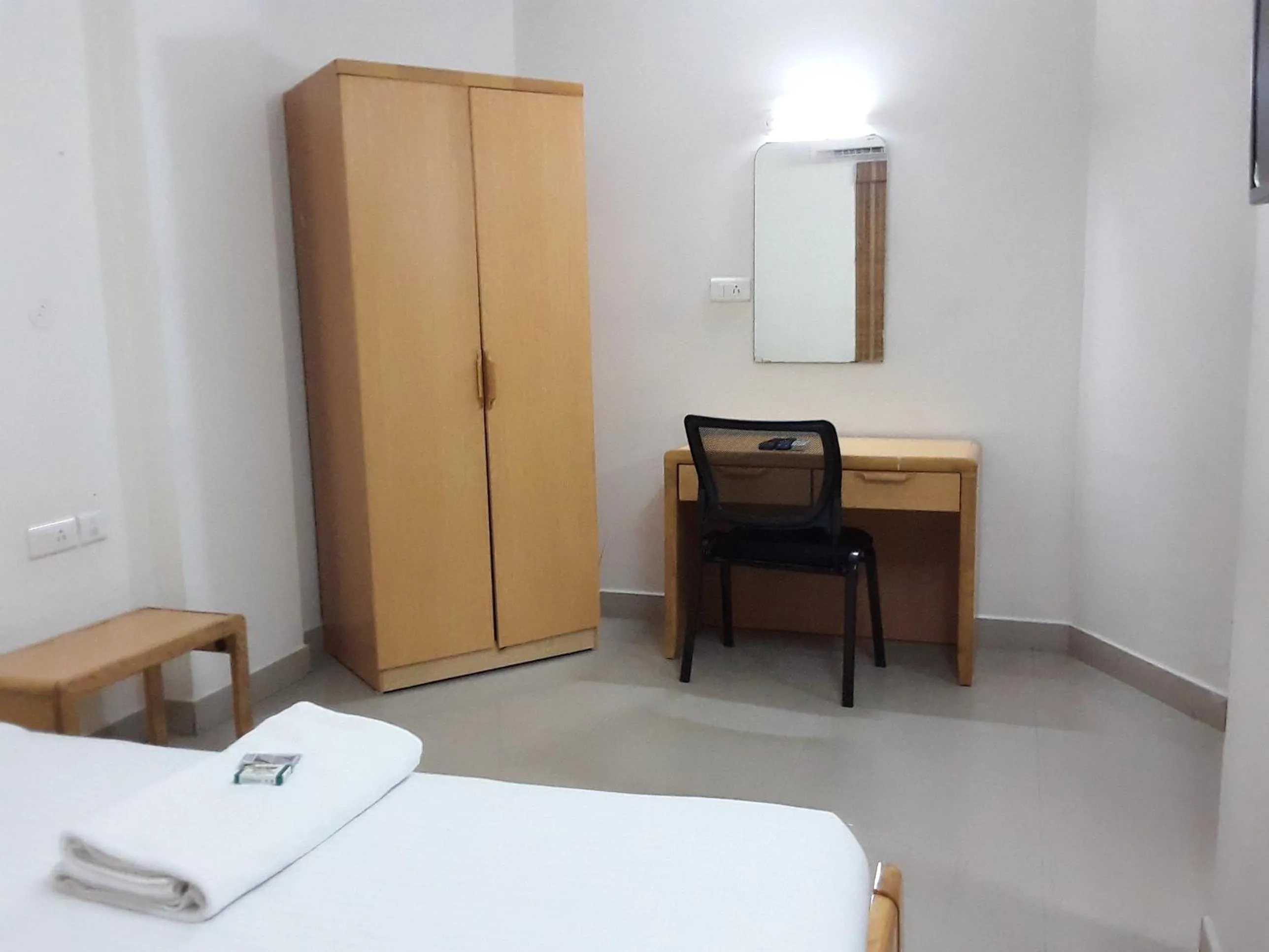 Bed in Hotel Tri-Star Residency