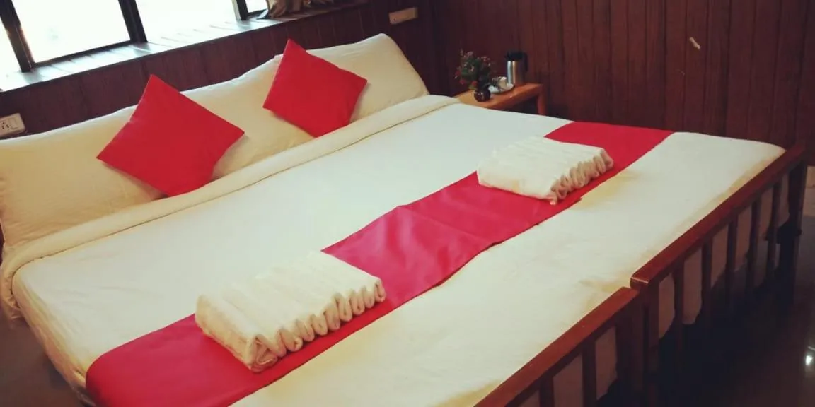 Bed in Hotel Tri-Star Residency